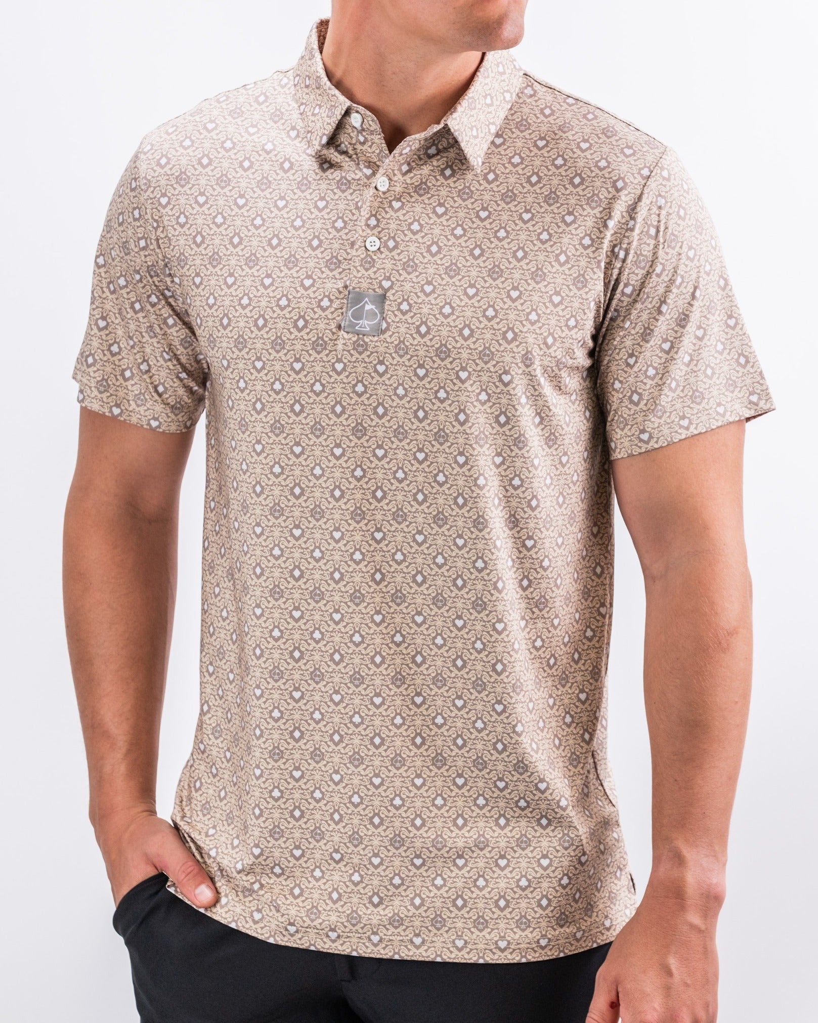 Men's short-sleeve golf polo in a beige pattern, featuring a collar and button placket for a stylish on-course look.