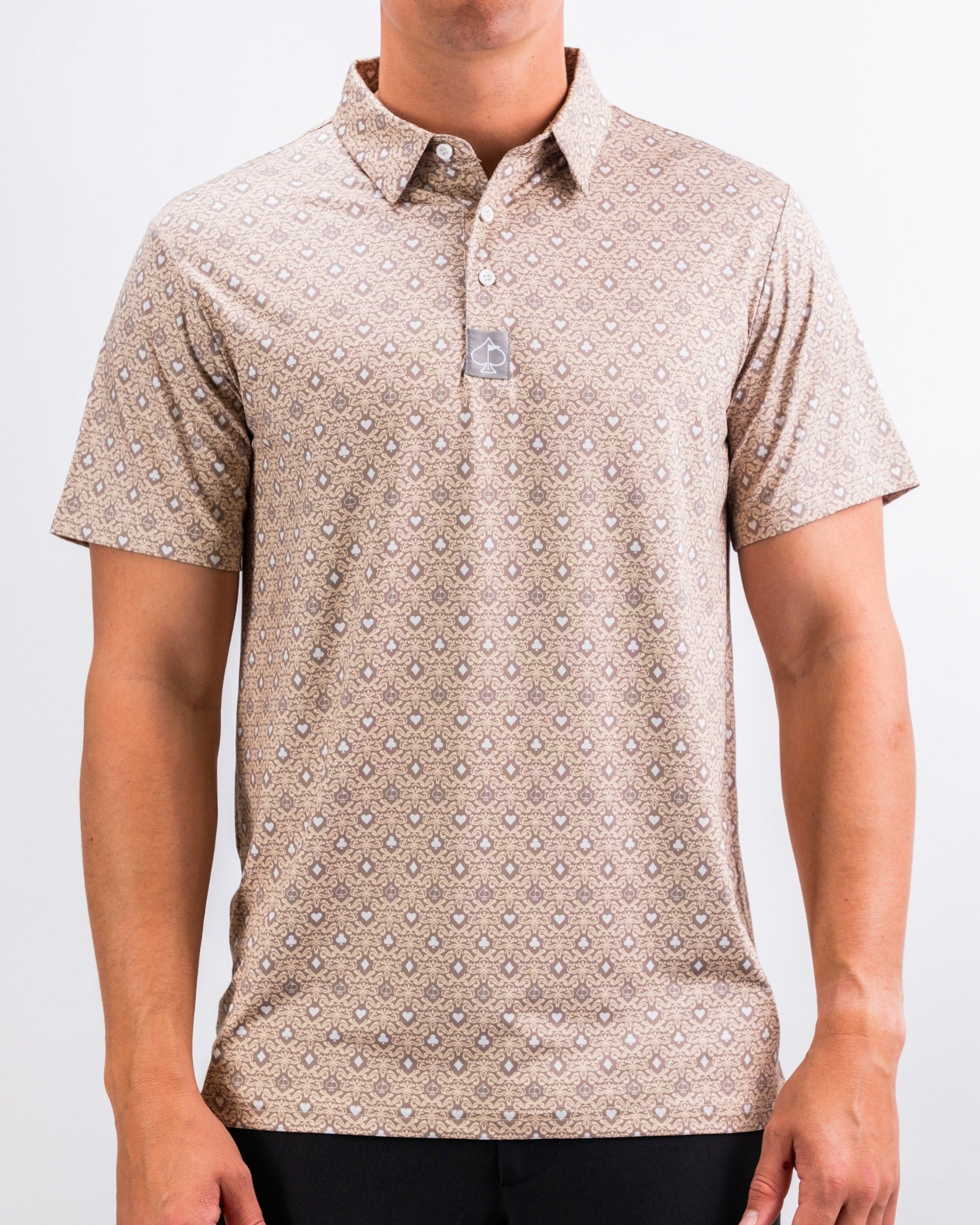 Men's golf polo shirt in a light tan color with a unique geometric pattern, designed for style and comfort on the course.