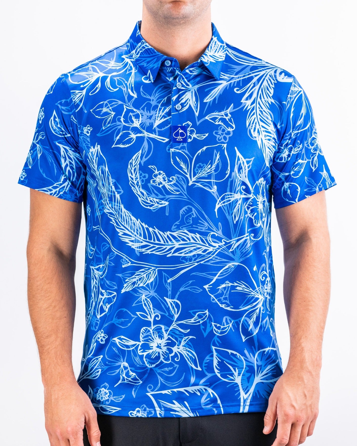 Bold blue golf shirt featuring a white floral and leaf pattern, designed for golfers who want to stand out on the course.