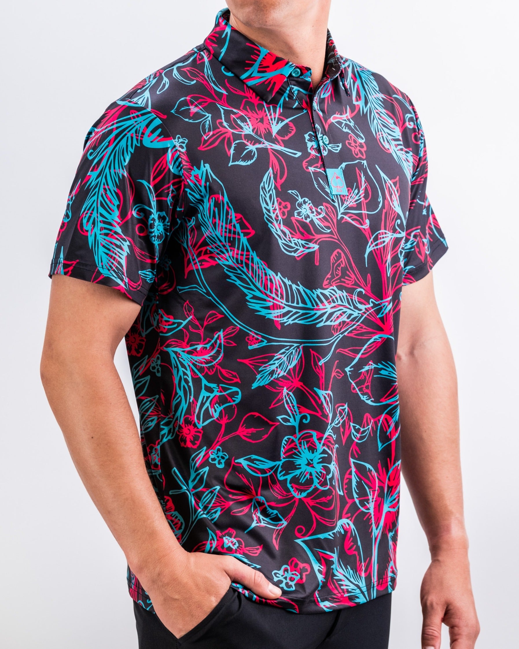 Bold floral-patterned golf polo shirt in black, featuring vibrant blue and red designs, perfect for stylish golfers.