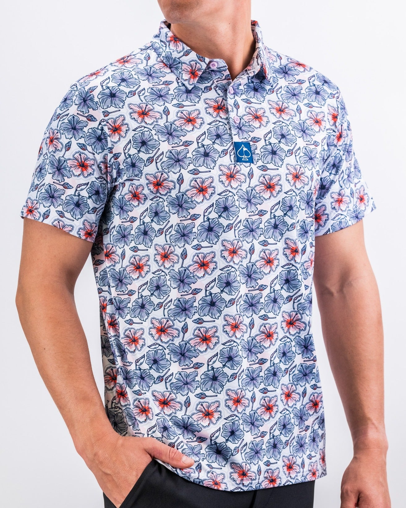 Men's golf polo shirt featuring a vibrant hibiscus floral pattern in red, blue, and white, perfect for stylish play on the course.