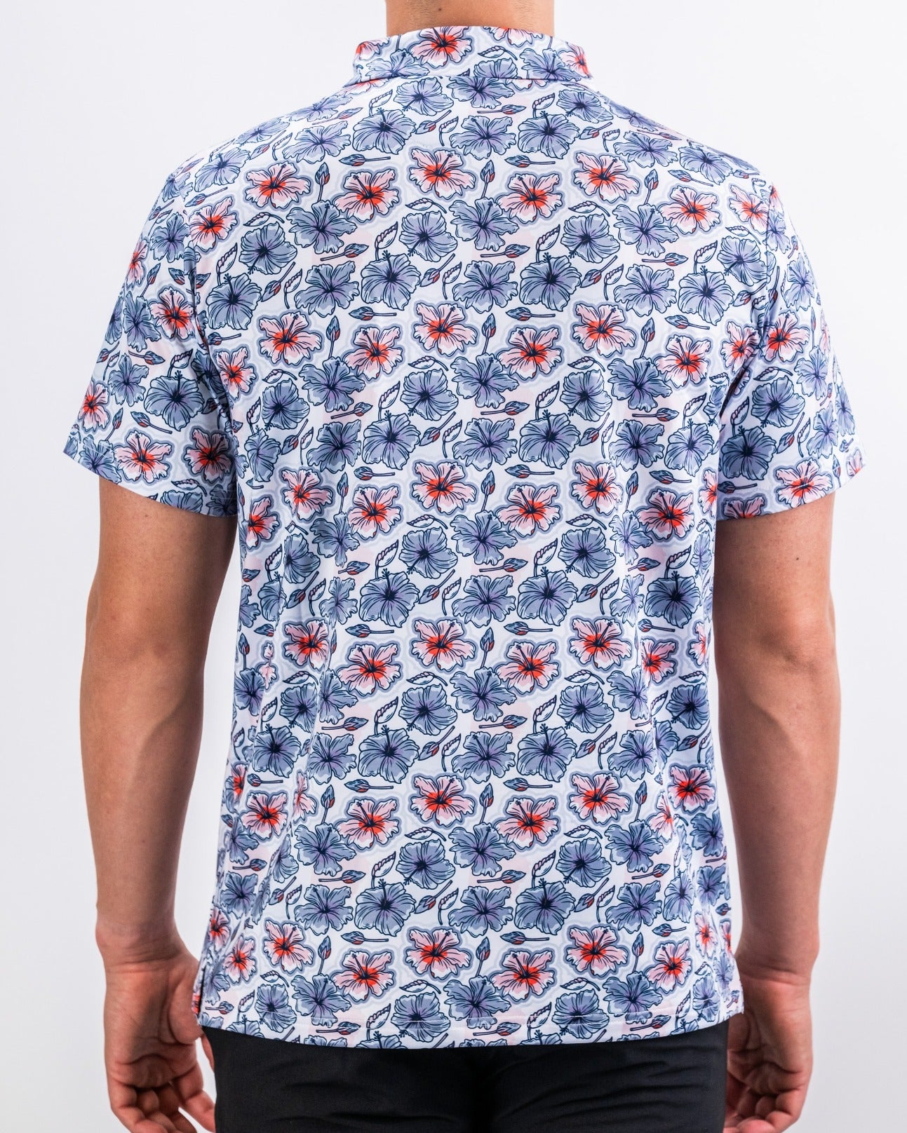 Men's short-sleeve golf shirt featuring a vibrant hibiscus floral pattern in blue and red tones, perfect for stylish play.