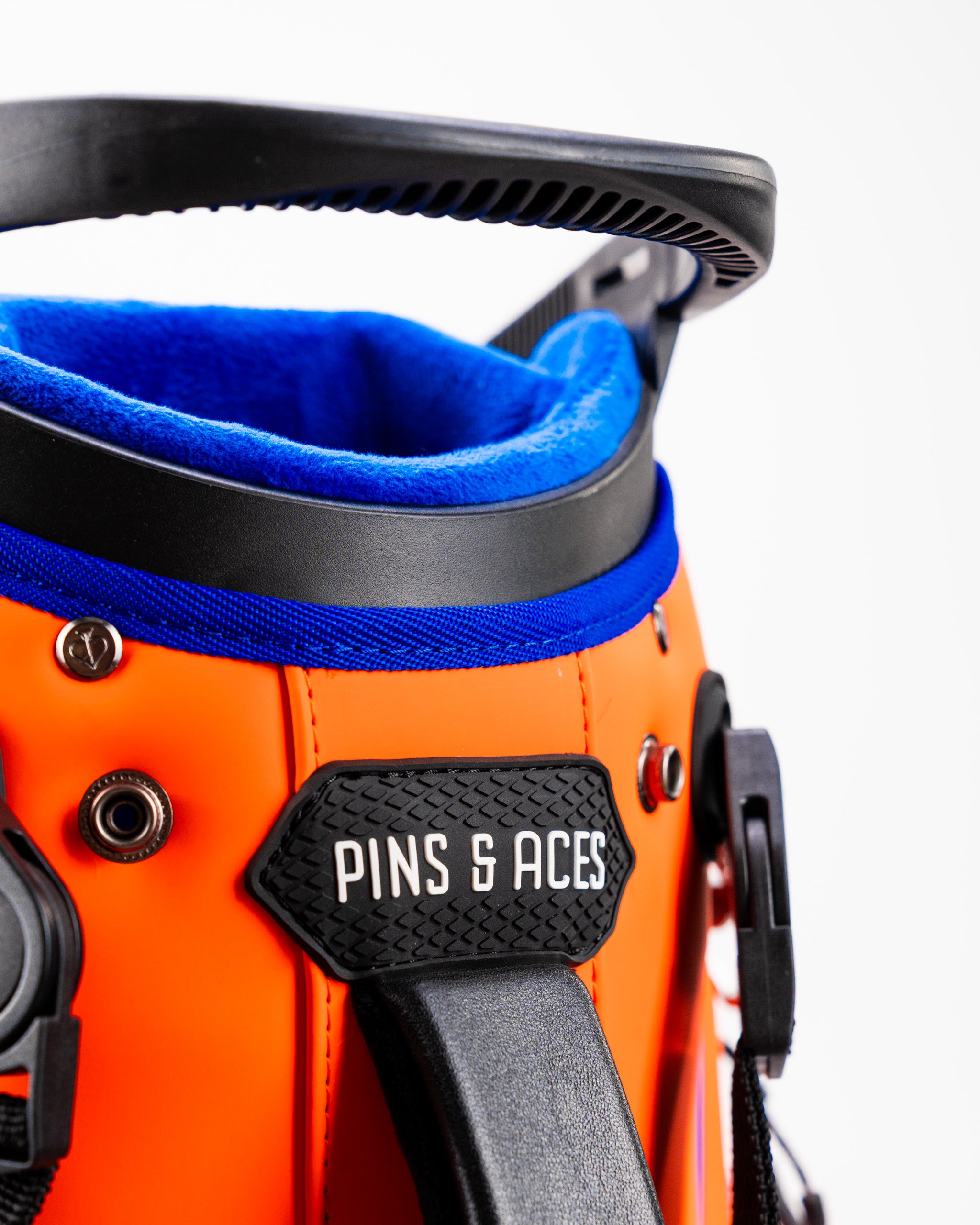 Close-up of the Player Preferred Golf Bag in Orange Crush, featuring a vibrant orange exterior and blue lining.