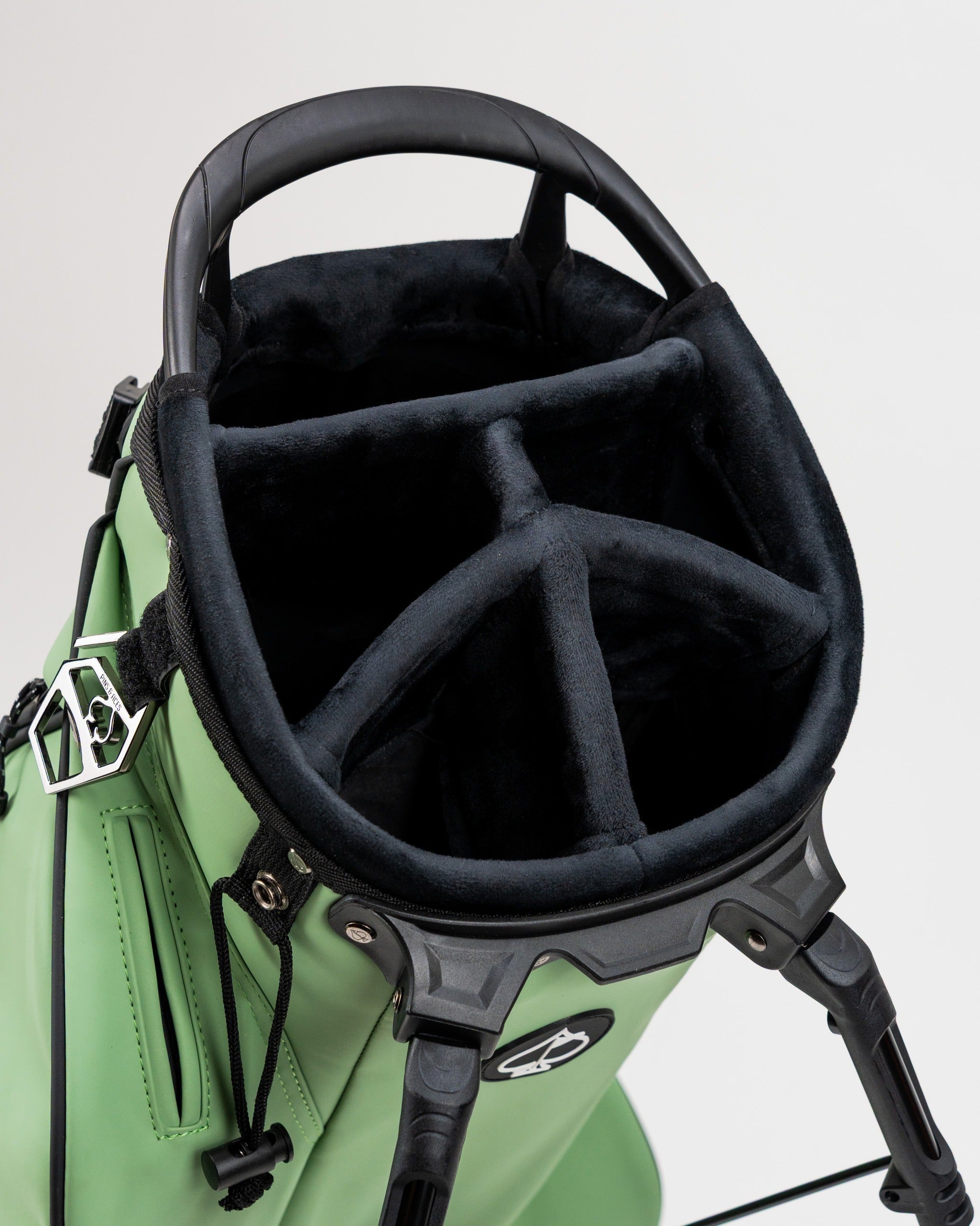 Top view of the Player Preferred Golf Bag in sage green, featuring a plush-lined compartment for club organization.