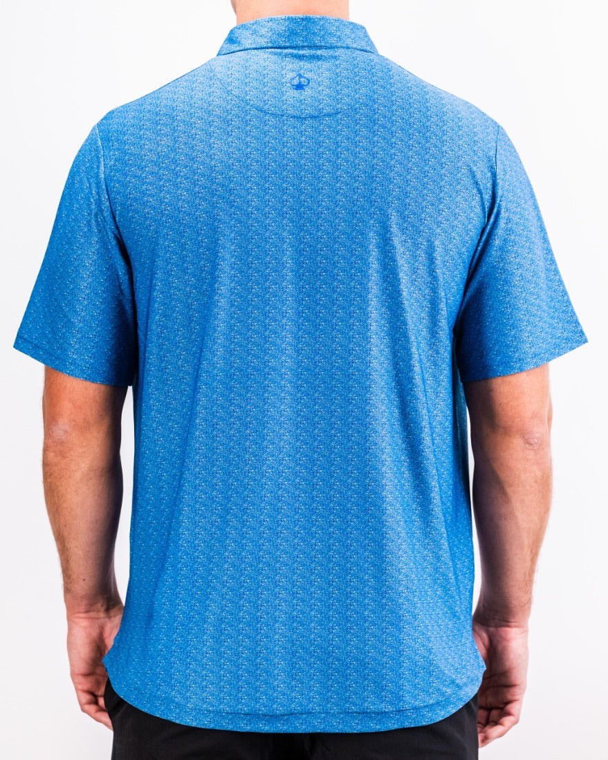 Men's Player Preferred Polo in Cosmic Swirl design, featuring a vibrant blue pattern and a classic collar.
