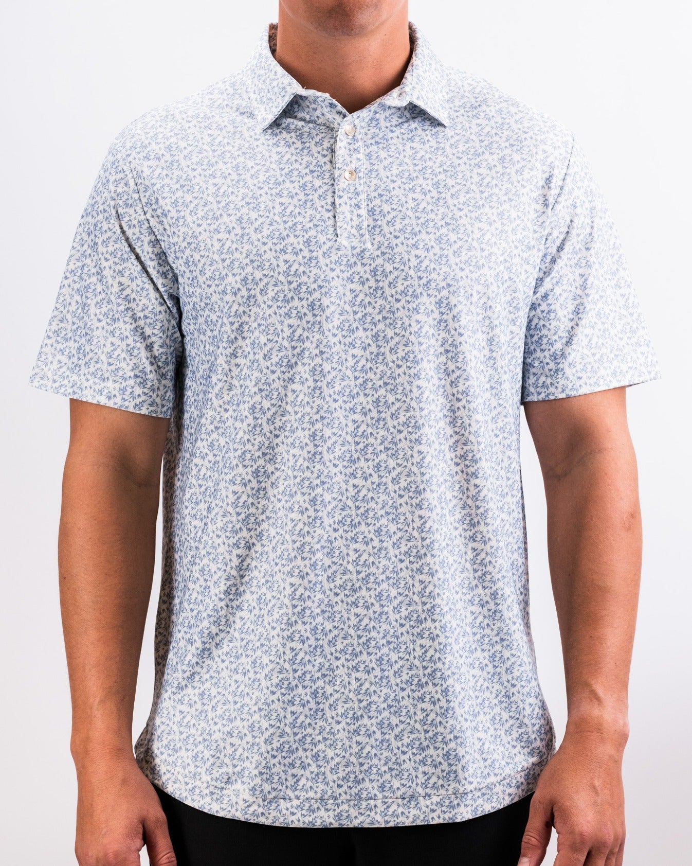 Player Preferred Polo in Olive Groves features a light blue floral pattern, perfect for stylish golf outings.