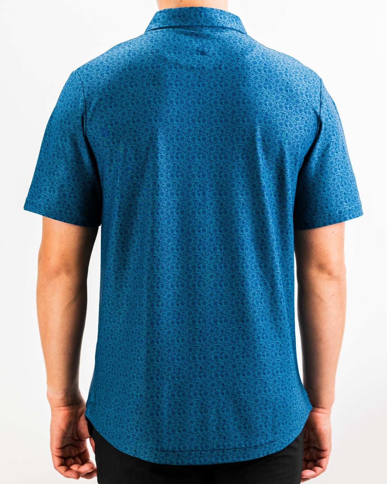 Back view of the Player Preferred Polo - The Mariner, featuring a vibrant blue pattern, designed for stylish golfers.
