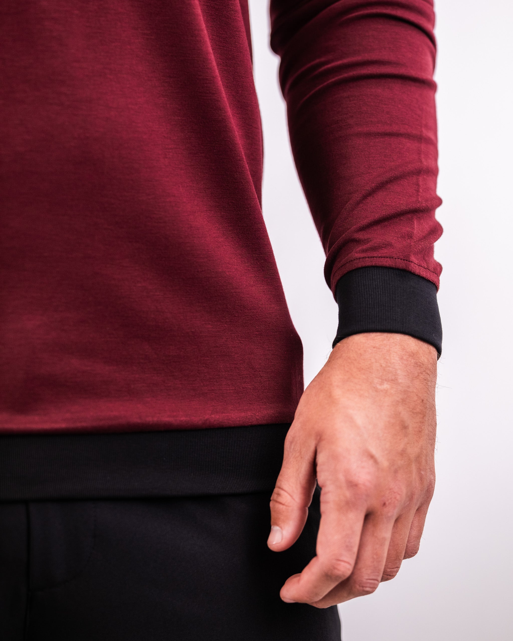 Men's Player Preferred Crewneck in Merlot, featuring a relaxed fit and contrasting black cuffs for a stylish golf look.