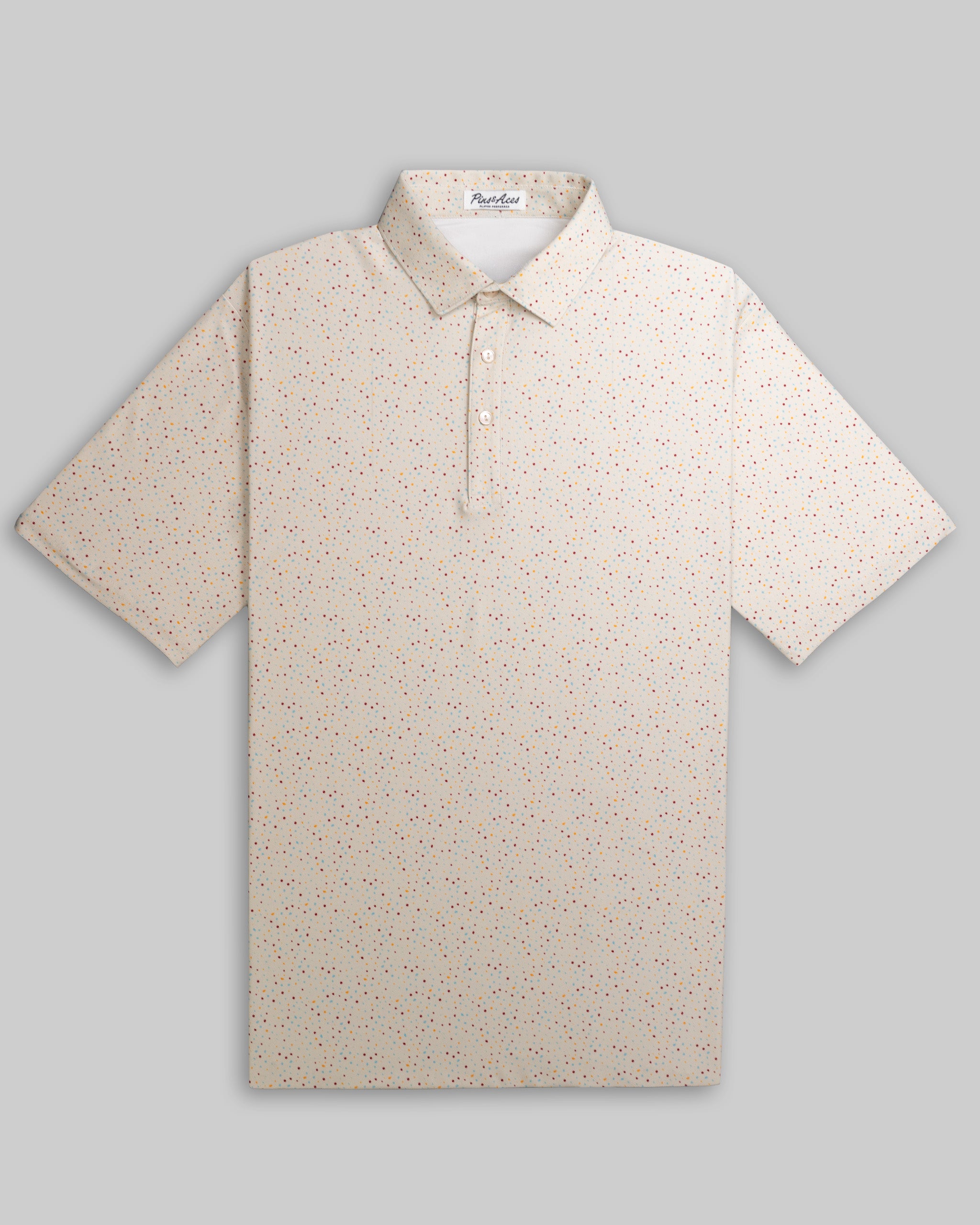 Player Preferred Polo in Terrazzo features a light beige base with colorful speckled patterns, ideal for stylish golfers.