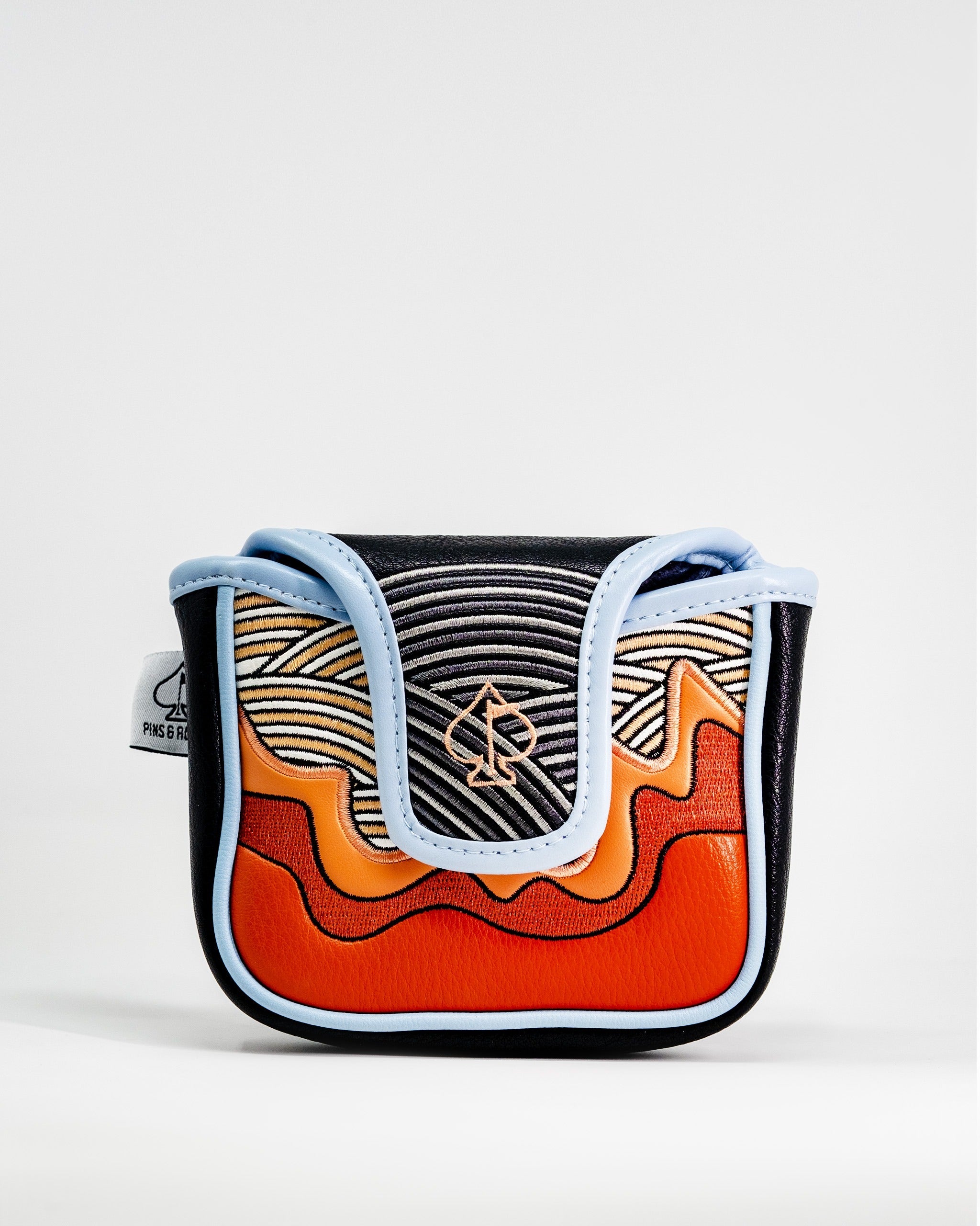 Bold mallet putter cover featuring vibrant orange, blue, and black waves, designed for golfers seeking unique style.