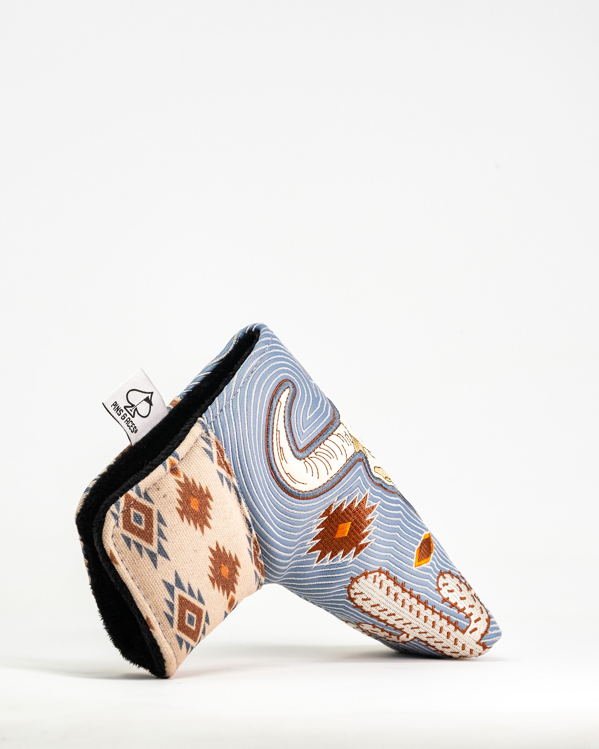 Western Aesthetic blade putter cover featuring a unique design with southwestern patterns and colors for stylish protection.