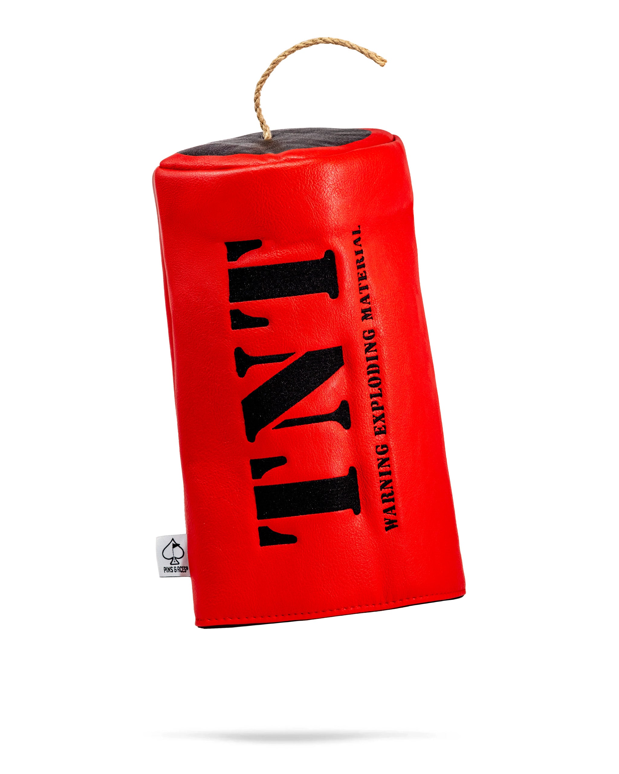 Bold red driver cover with "TNT" printed in black, featuring a warning label and a decorative rope handle.
