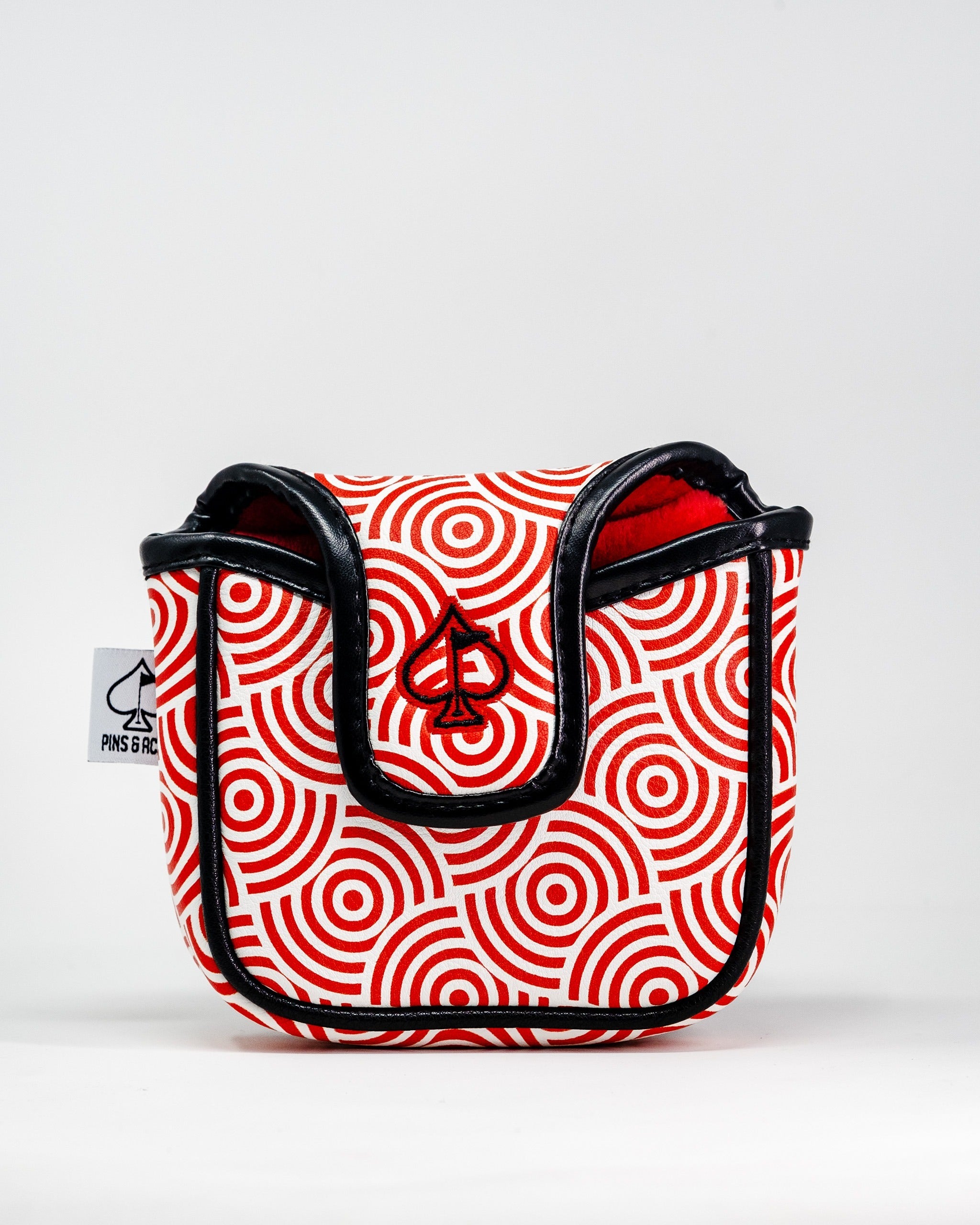 Bold red and white spiral-patterned mallet putter cover with black trim, featuring the Pins and Aces logo.