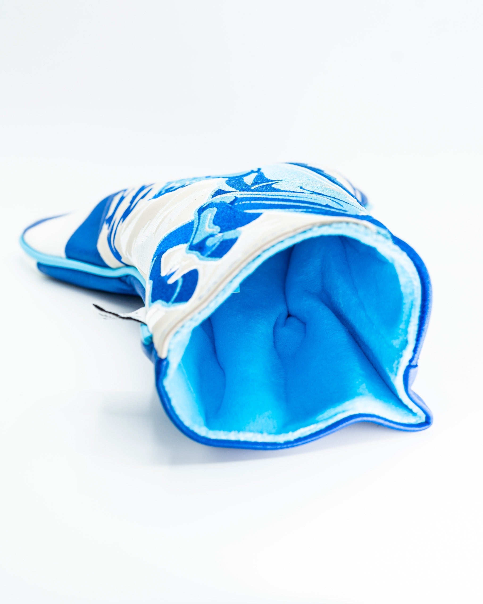 Bold blue and white driver cover featuring a unique design, perfect for golfers looking to stand out on the course.