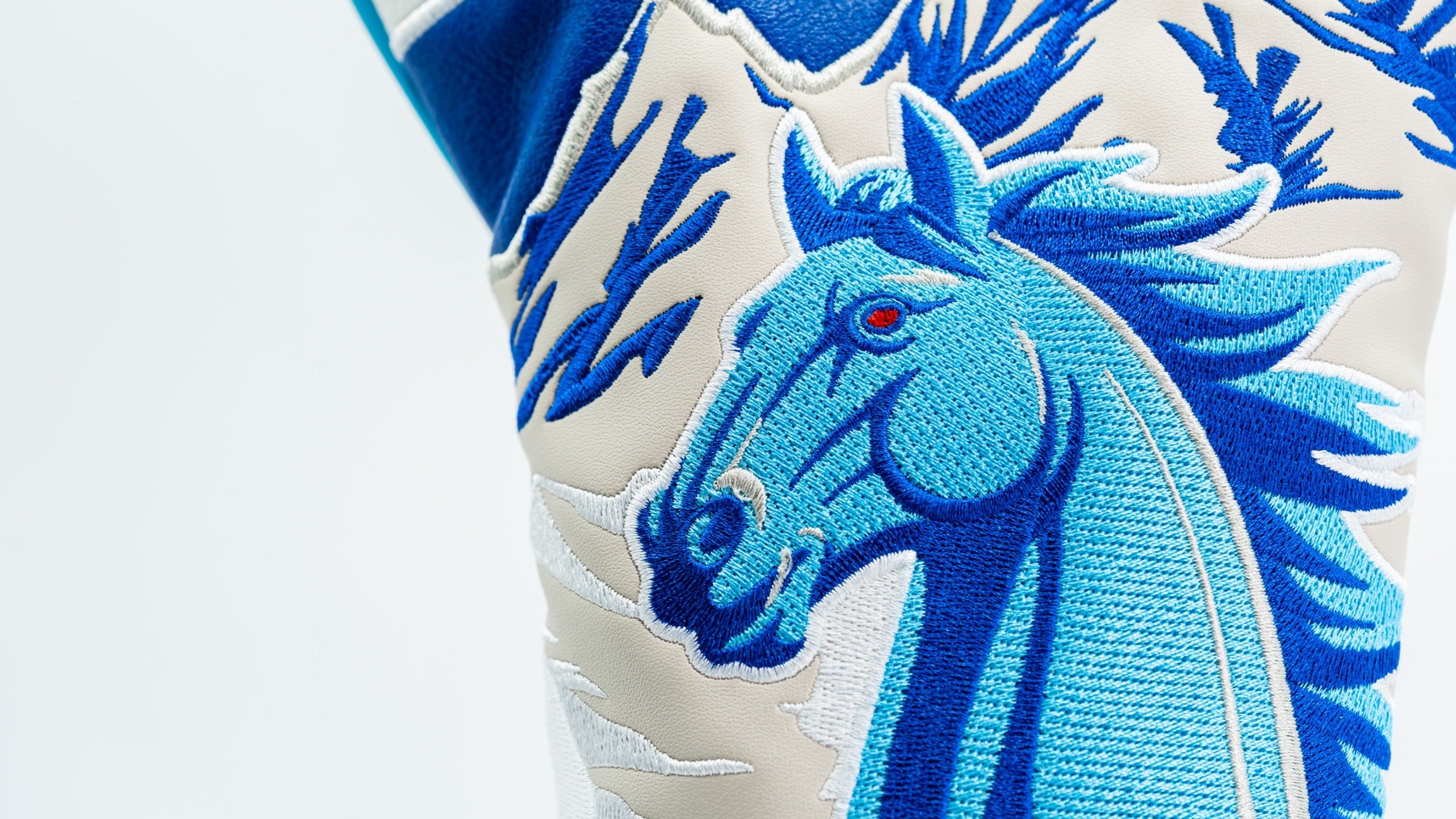 Bold blue horse design driver cover with intricate embroidery, perfect for golfers wanting to stand out on the course.