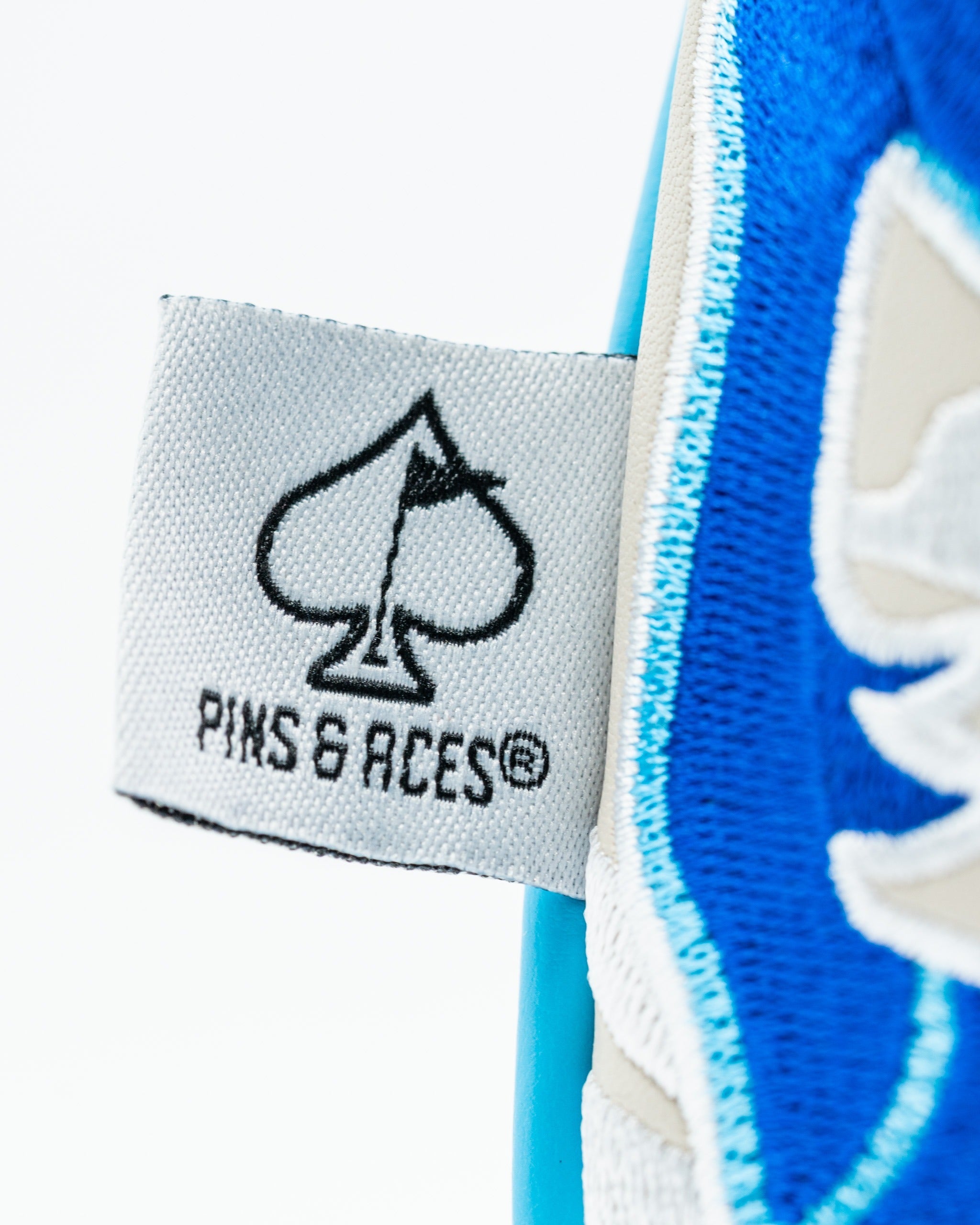 Bold Blucifer driver cover featuring a striking blue design and Pins & Aces logo for standout style on the golf course.