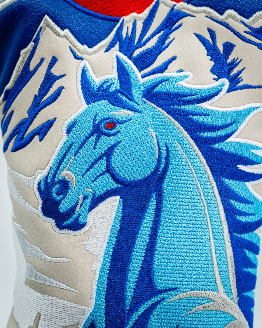 Bold blue horse driver cover featuring intricate embroidery and striking red accents, perfect for golfers seeking unique style.