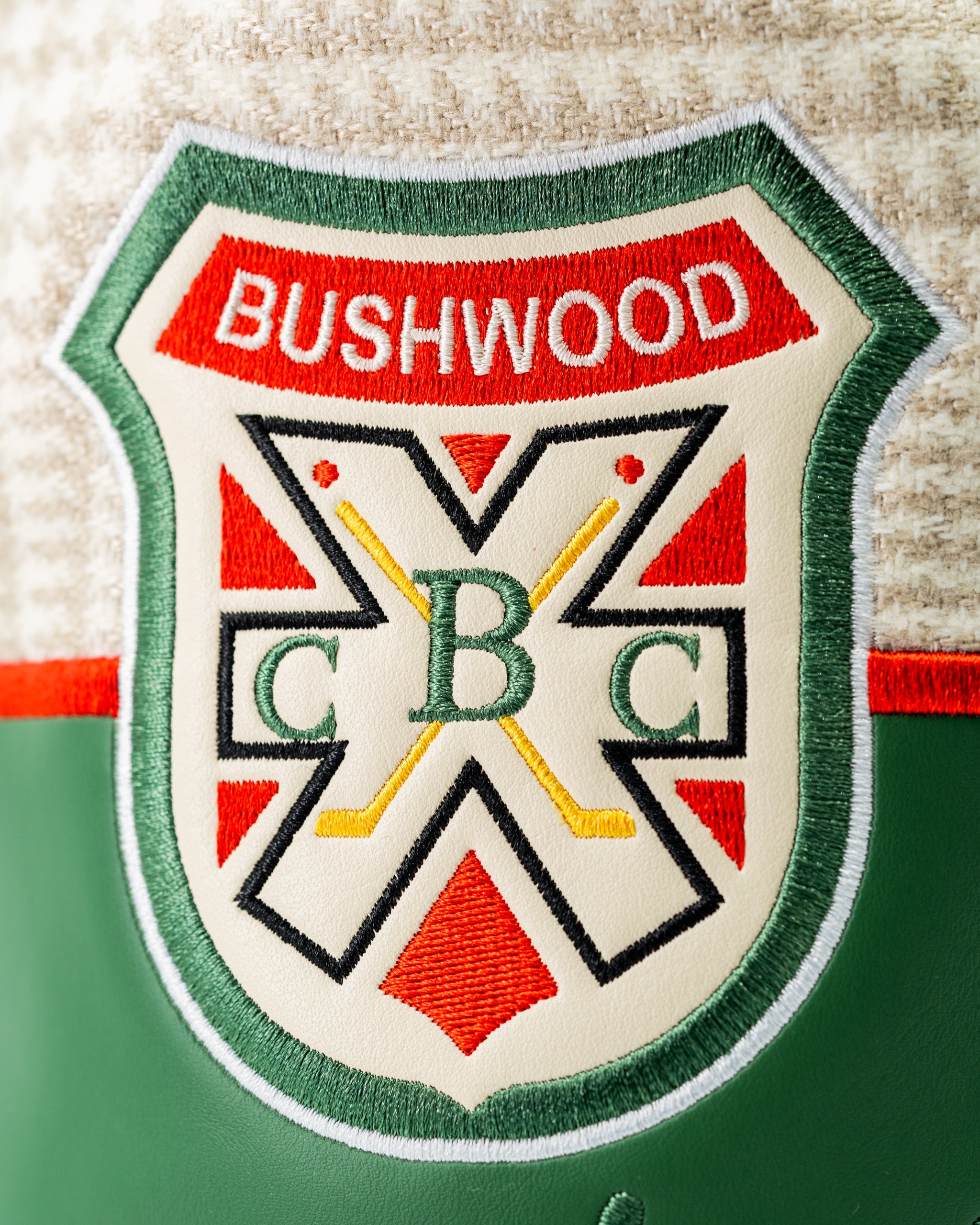 Bushwood CC driver cover featuring a detailed embroidered logo with vibrant colors and a classic design for stylish golfers.