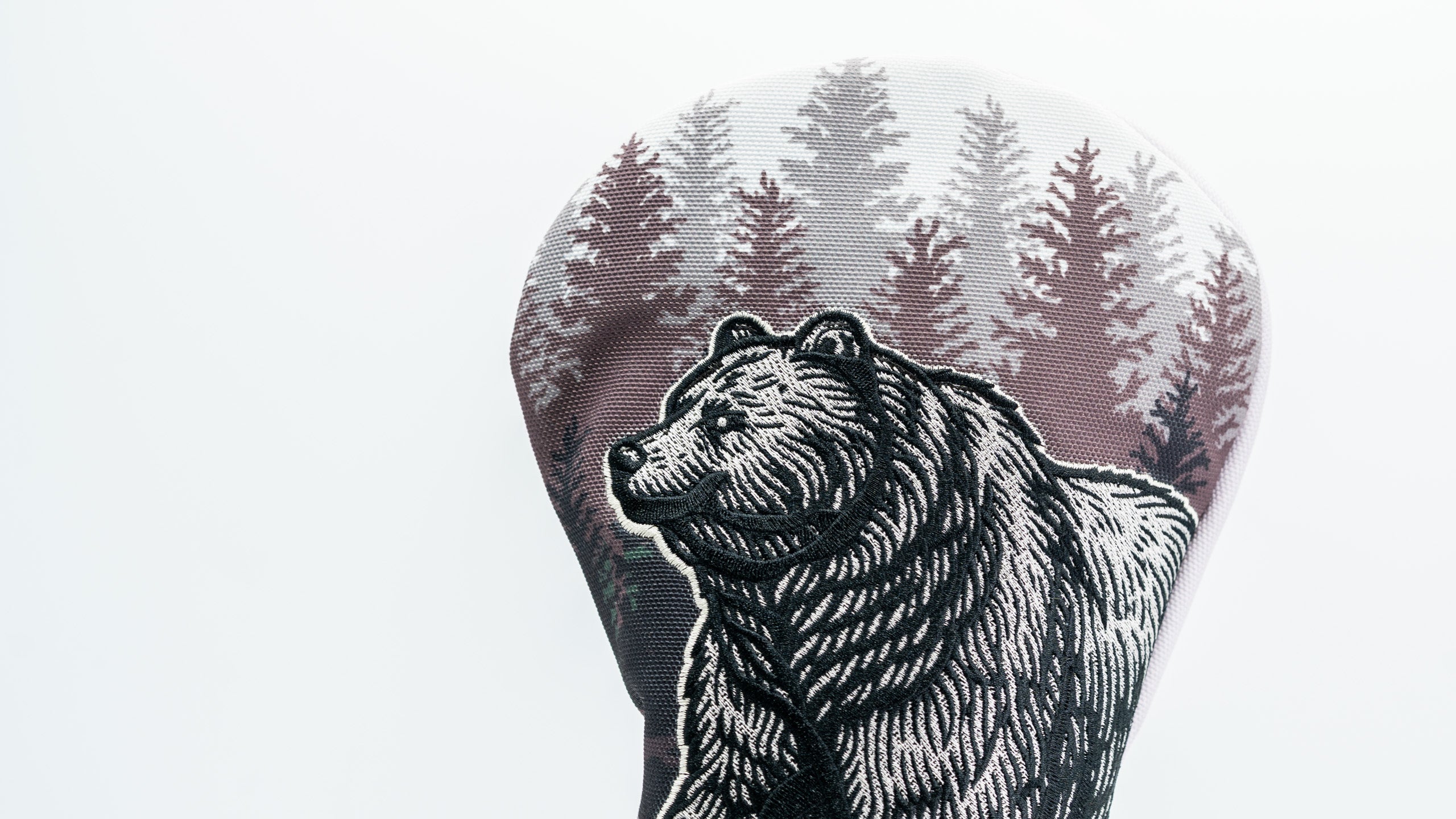 Bold driver cover featuring a detailed bear design against a backdrop of trees, perfect for standout golf style.