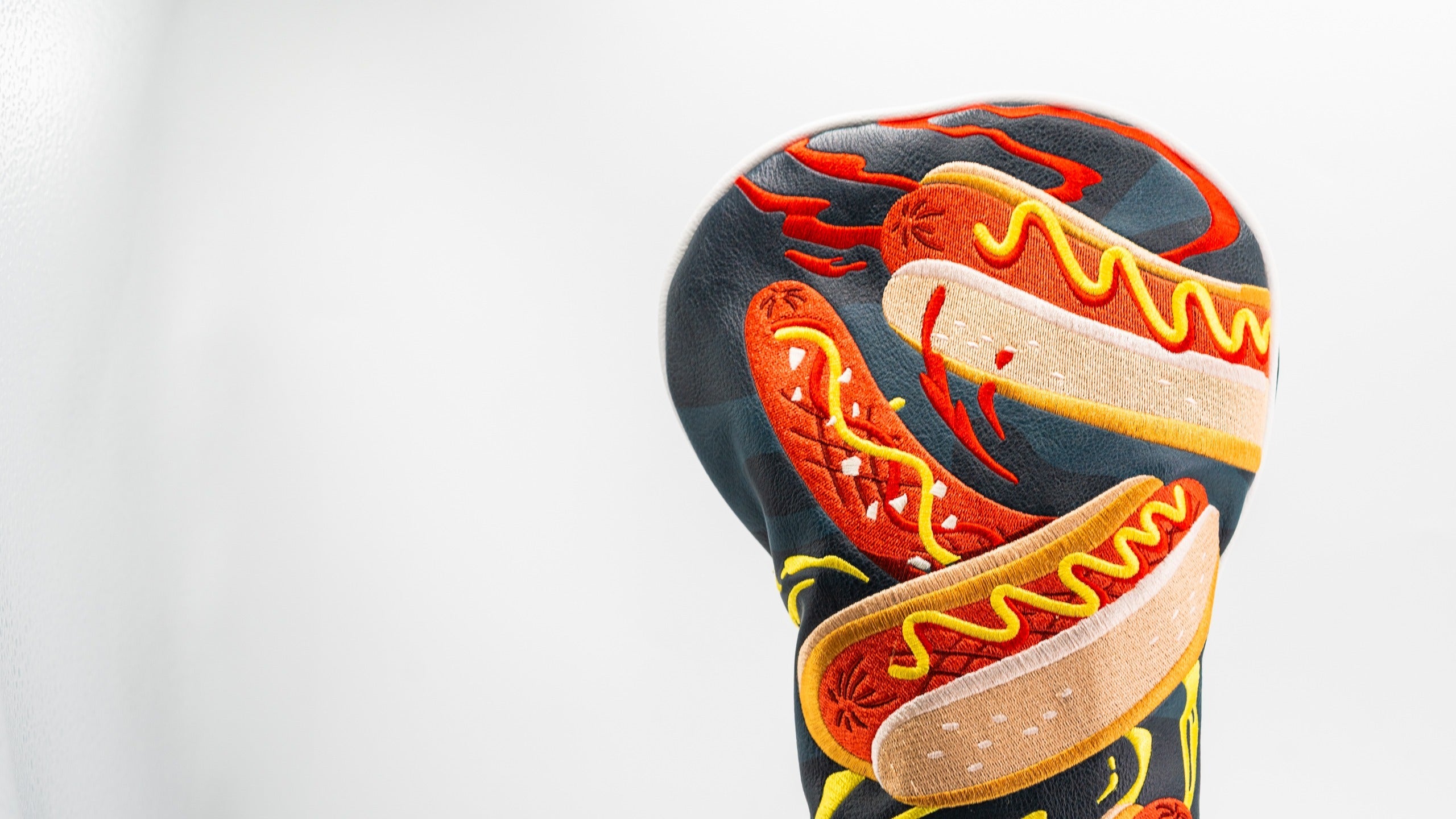 Bold driver cover featuring colorful hot dog designs, perfect for golfers wanting to make a statement on the course.