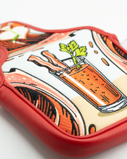 Bold Bloody Mary mallet putter cover featuring vibrant graphics of a cocktail with bacon and celery, perfect for standout golfers.