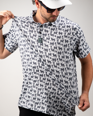 Man wearing a Highland Cow patterned polo shirt, showcasing its unique design and comfortable fit.