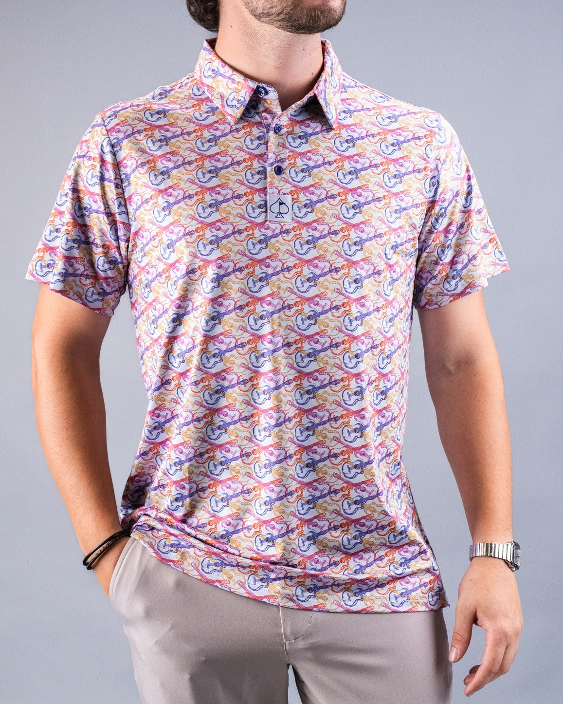 Men's Margaritaville License to Chill polo shirt featuring a colorful guitar and tropical pattern, perfect for casual outings.