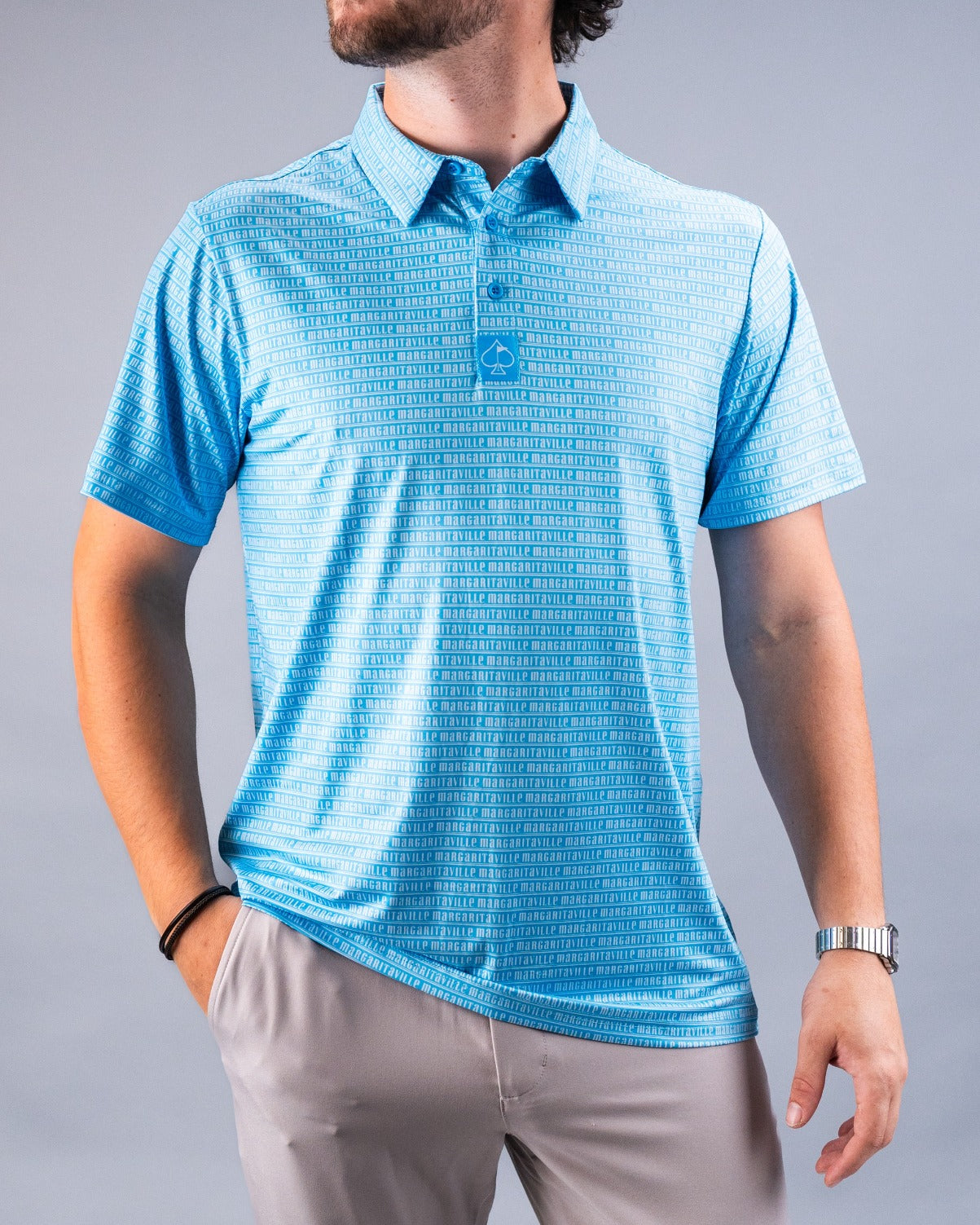 Light blue short-sleeve polo shirt with a patterned design, perfect for casual golf outings or summer wear.