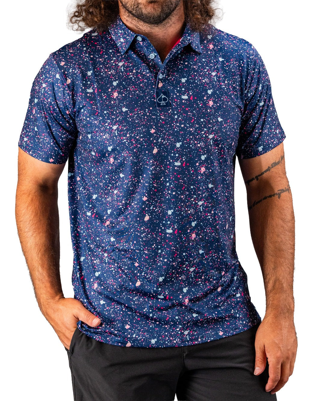 Men's blue splatter golf polo featuring a vibrant abstract design, perfect for standing out on the course.