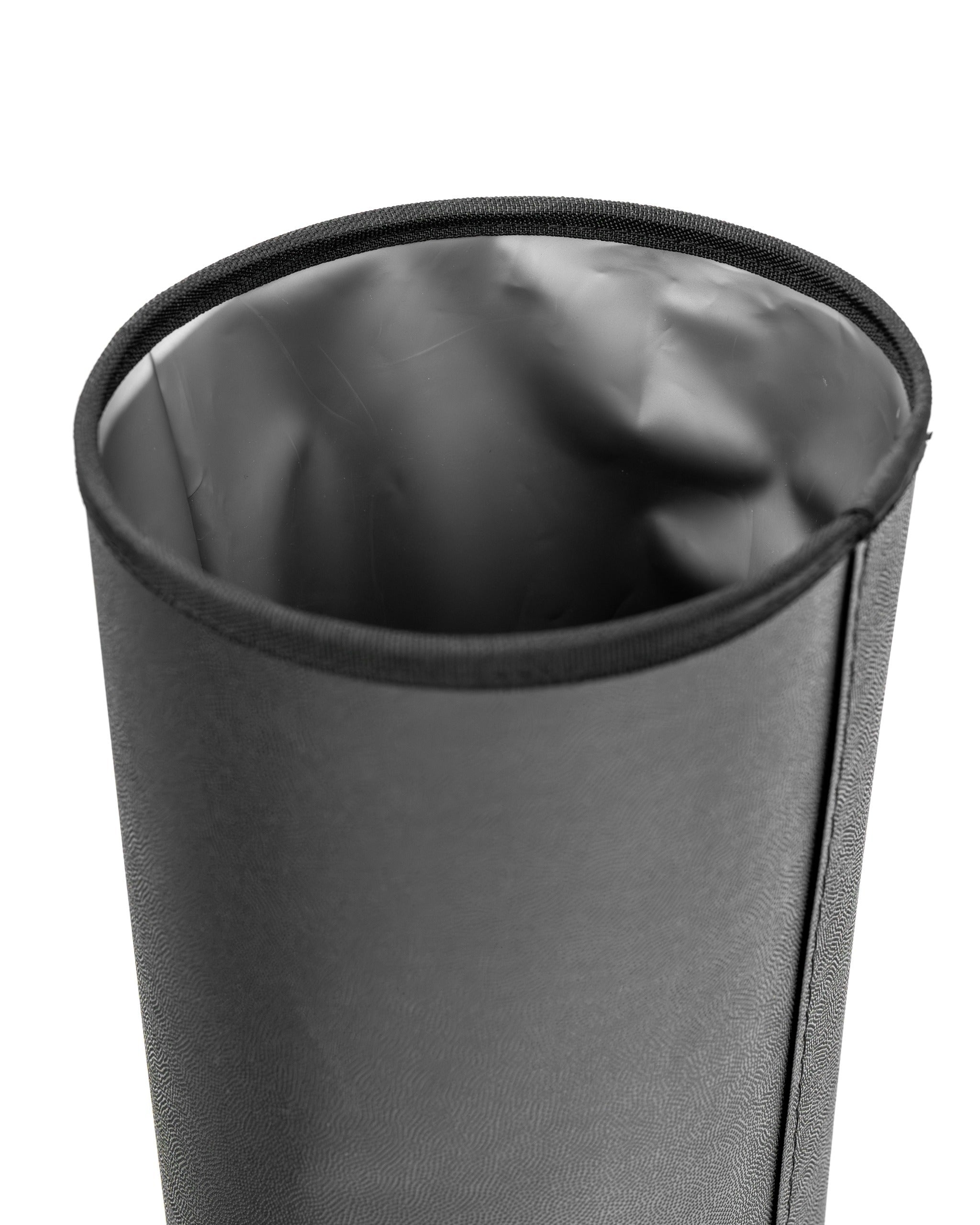 Close-up of the Den Caddy in flat ash color, showcasing its sleek, cylindrical design and smooth interior lining.