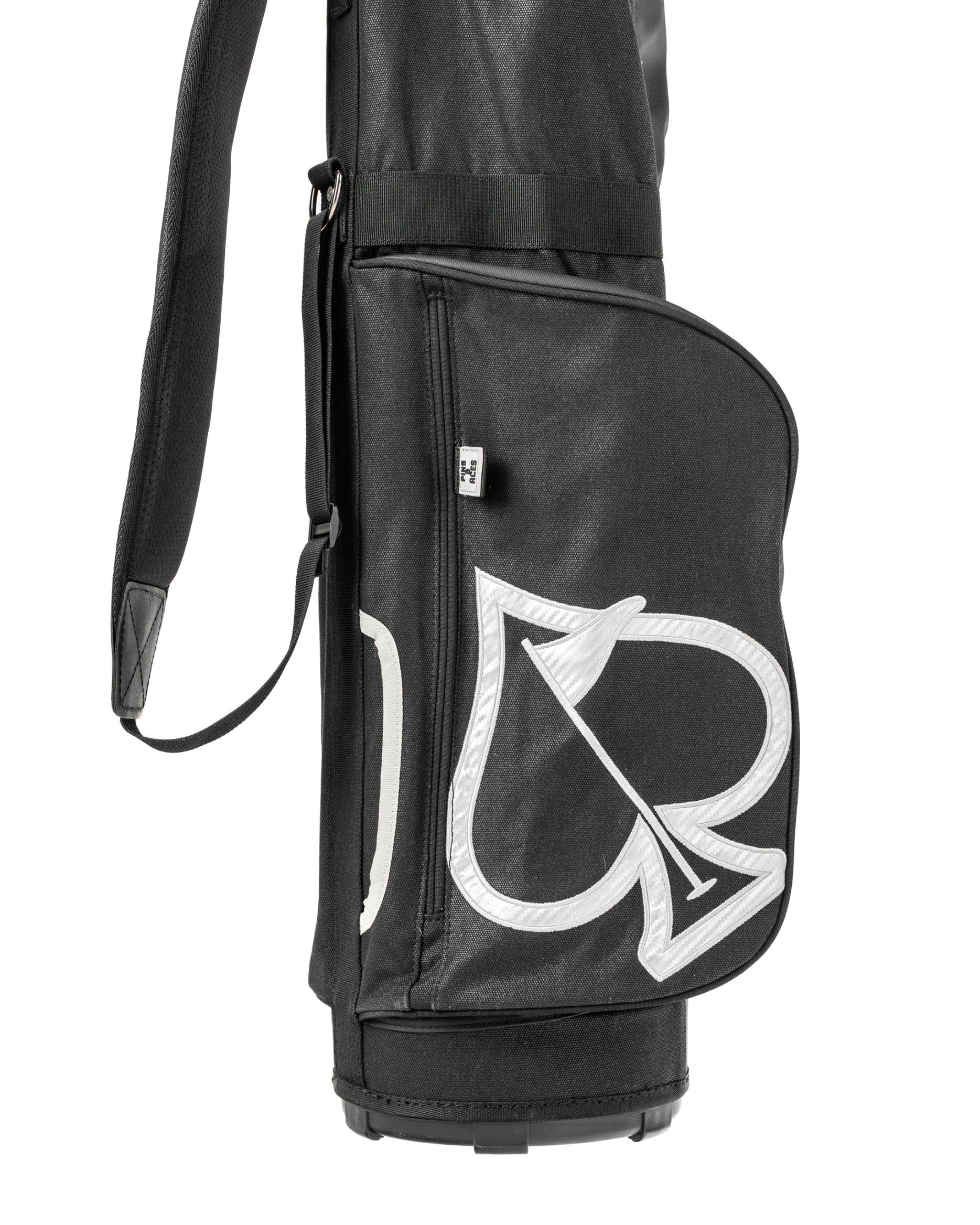 Sleek black Sunday golf bag featuring a prominent white spade logo, designed for stylish and practical use on the course.
