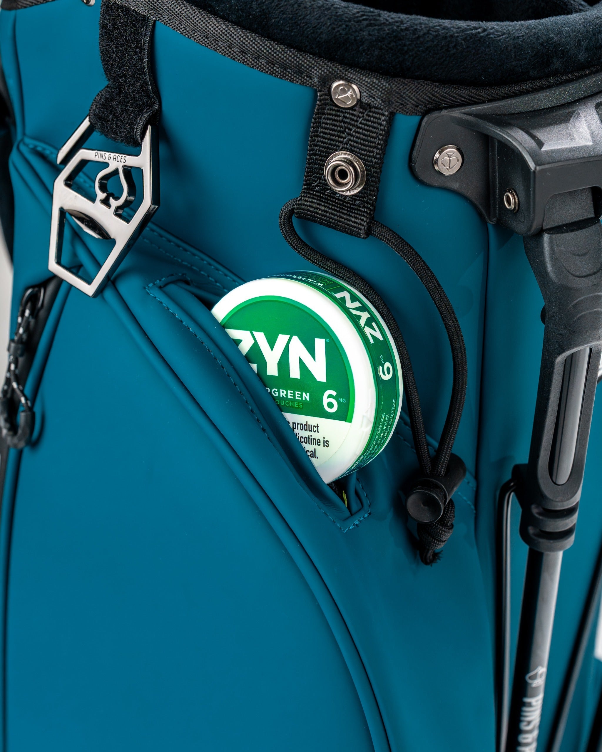 Close-up of the Player Preferred Golf Bag in Sea Strike color, featuring a pocket with a golf accessory inside.