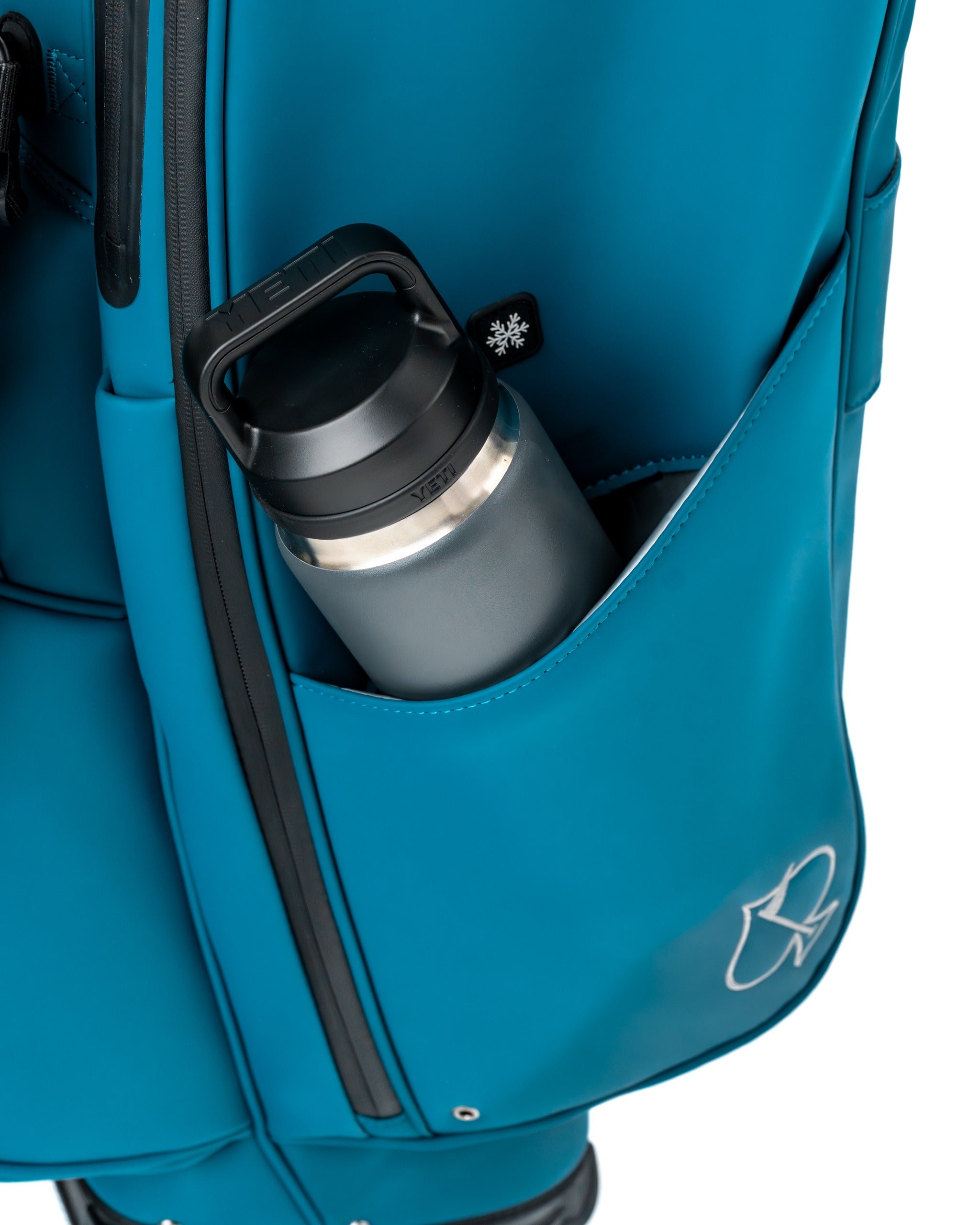 Close-up of the Player Preferred Golf Bag in Sea Strike color, featuring a side pocket with a water bottle.