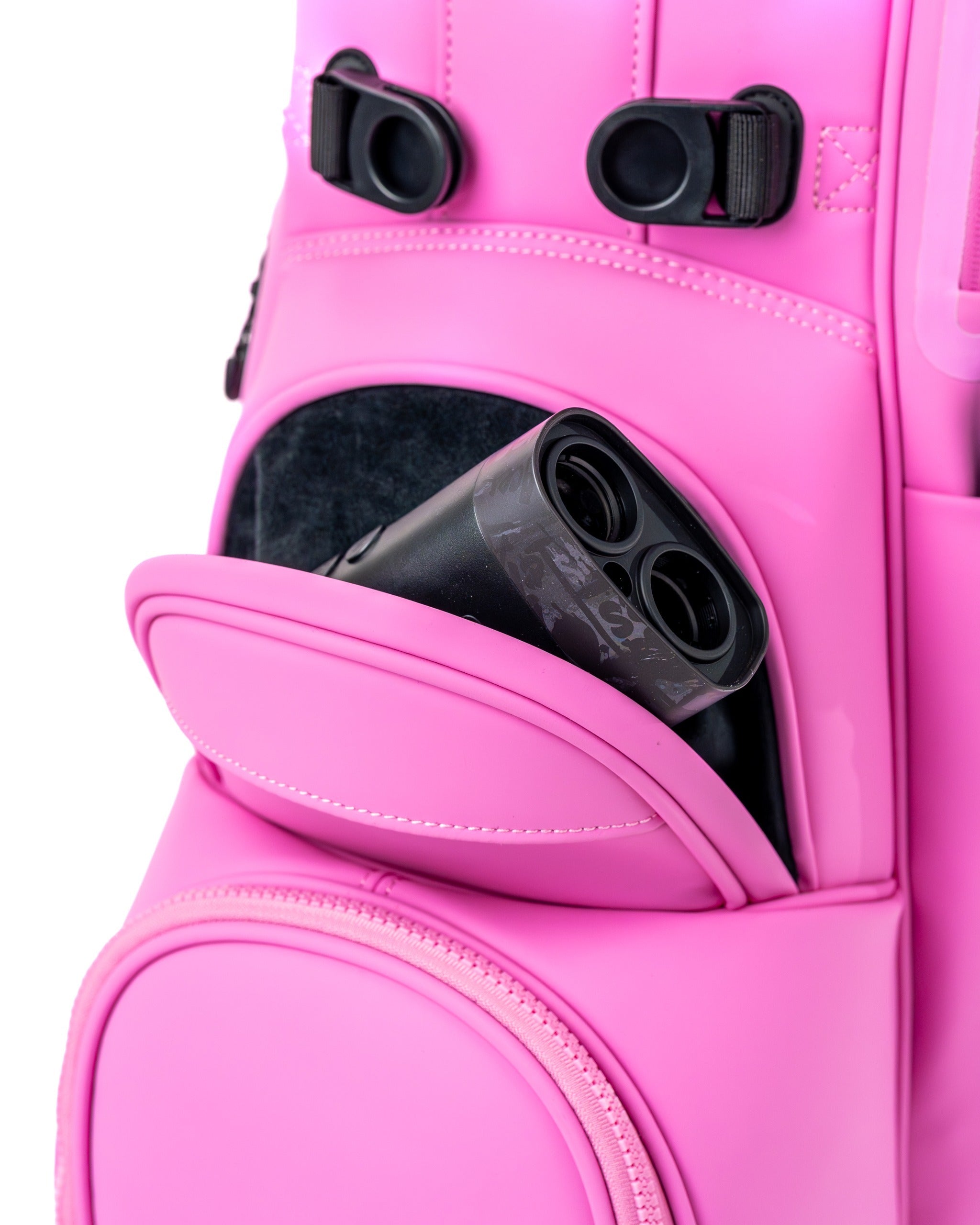 Bright pink Player Preferred Golf Bag featuring a pocket with a golf rangefinder peeking out, showcasing its stylish design.