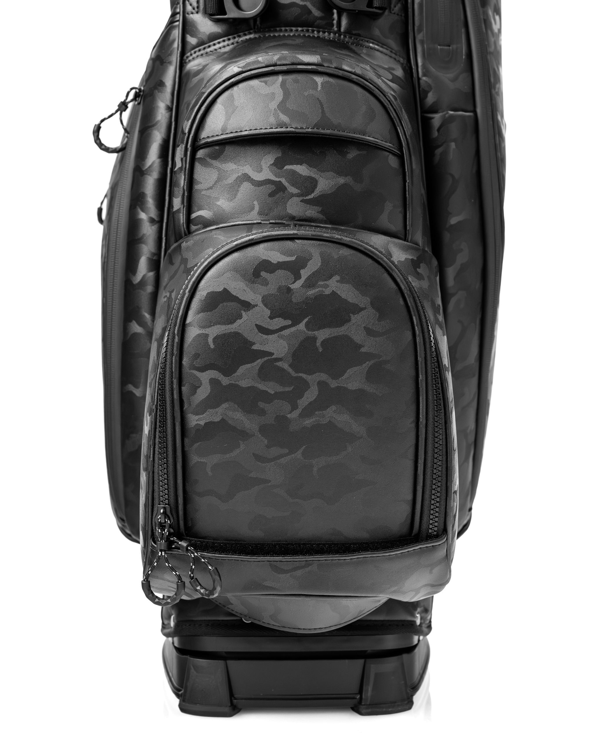Black camo golf bag featuring multiple zippered pockets and a sleek design for stylish golfers on the course.