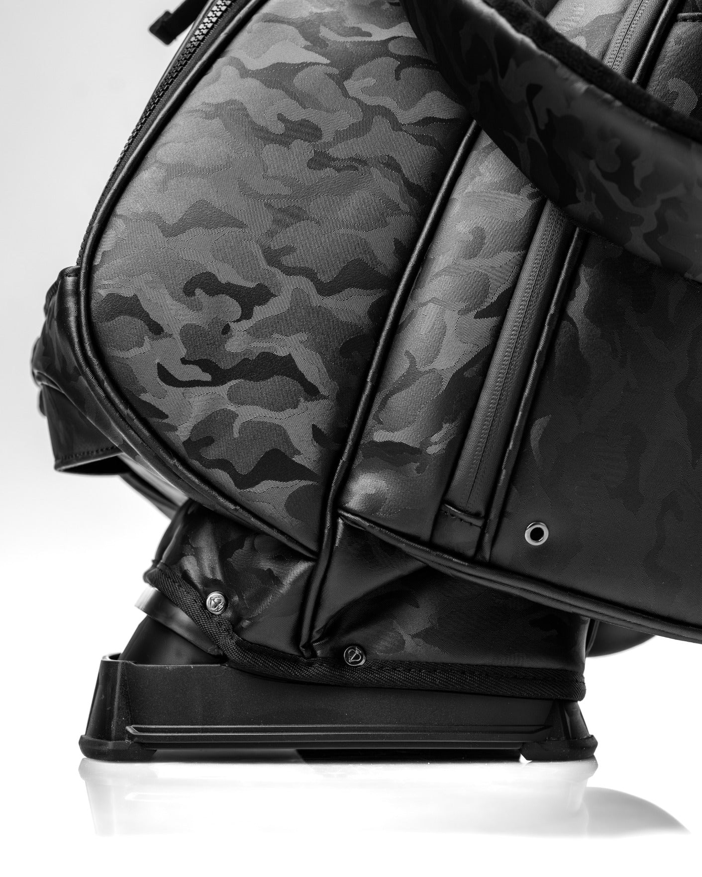 Black camo golf bag featuring a sleek design and durable materials, ideal for stylish golfers on the course.