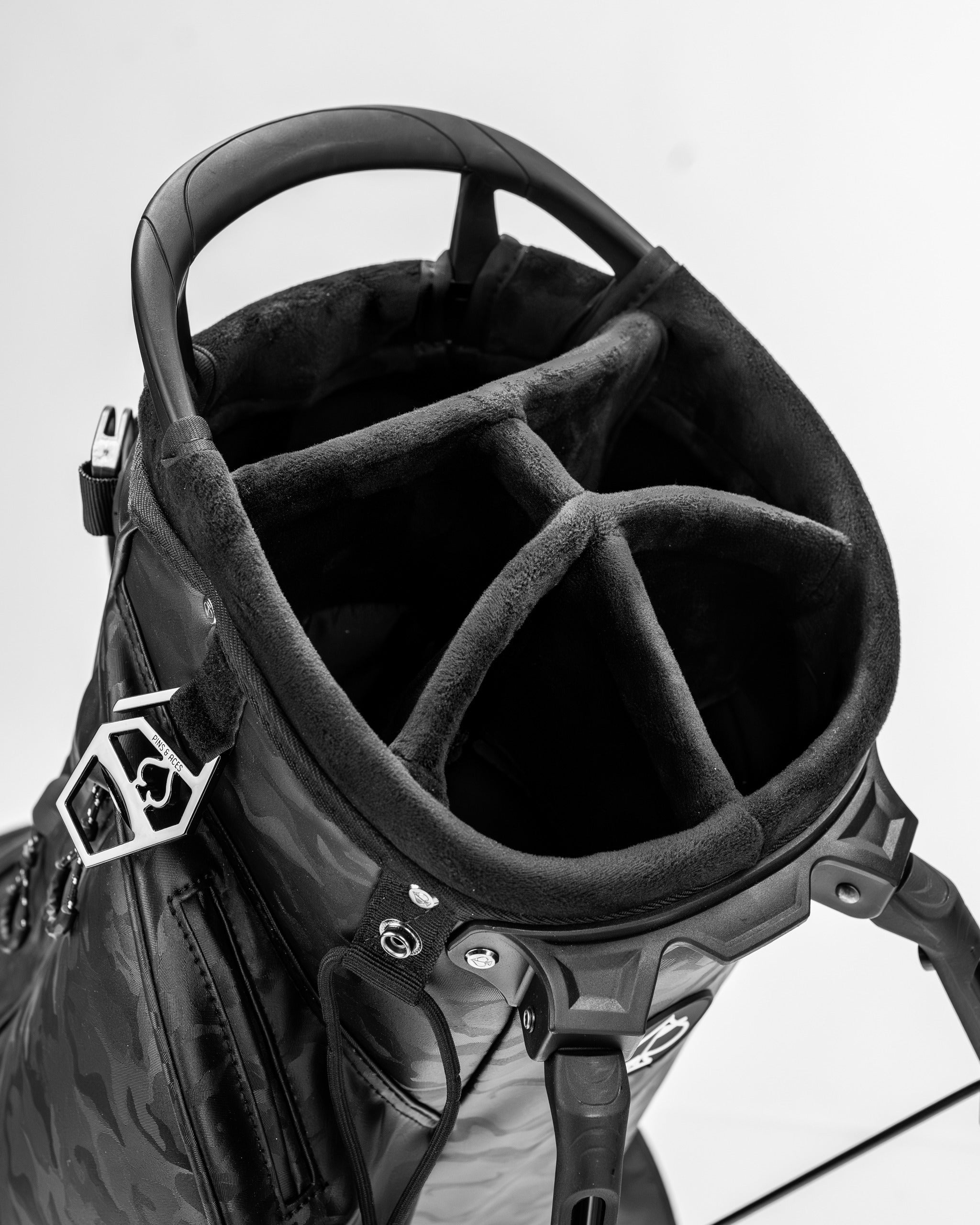 Top view of the Player Preferred Golf Bag in black camo, showcasing its spacious, padded compartments for clubs.