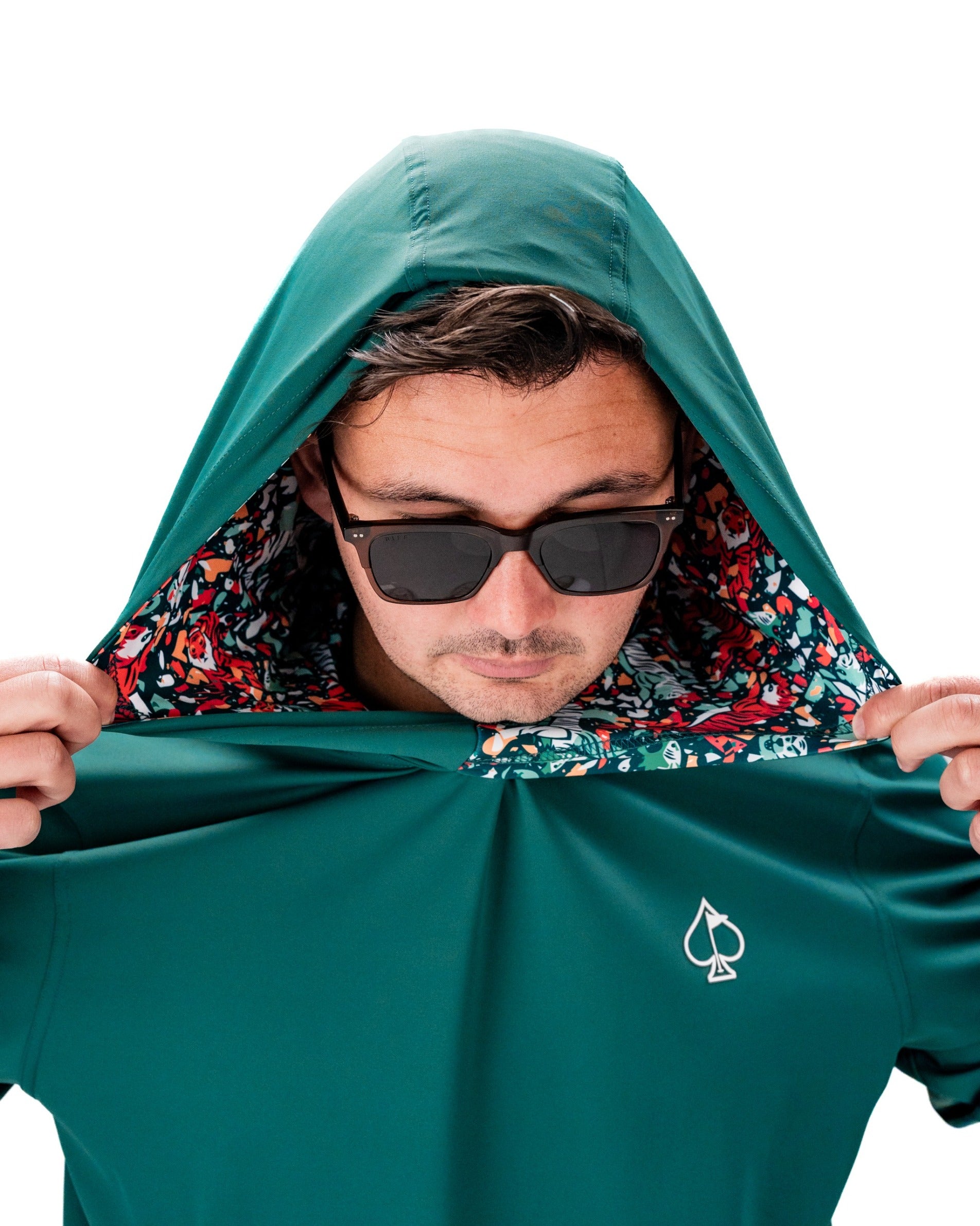 Performance Golf Hoodie in Tiger Shatter Teal, featuring a vibrant floral lining and a stylish hood. Perfect for golfers.