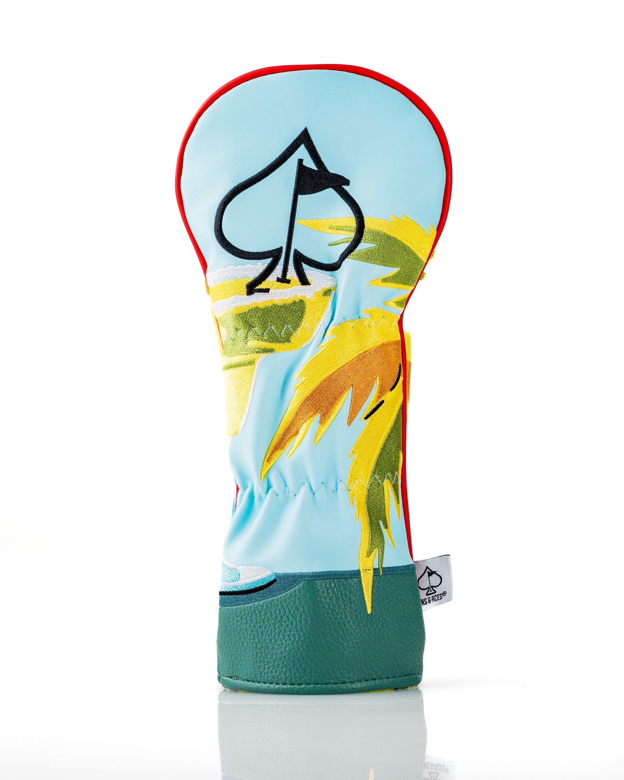 Vibrant golf headcover featuring a tropical design with palm trees and a blue background, perfect for adding flair on the course.