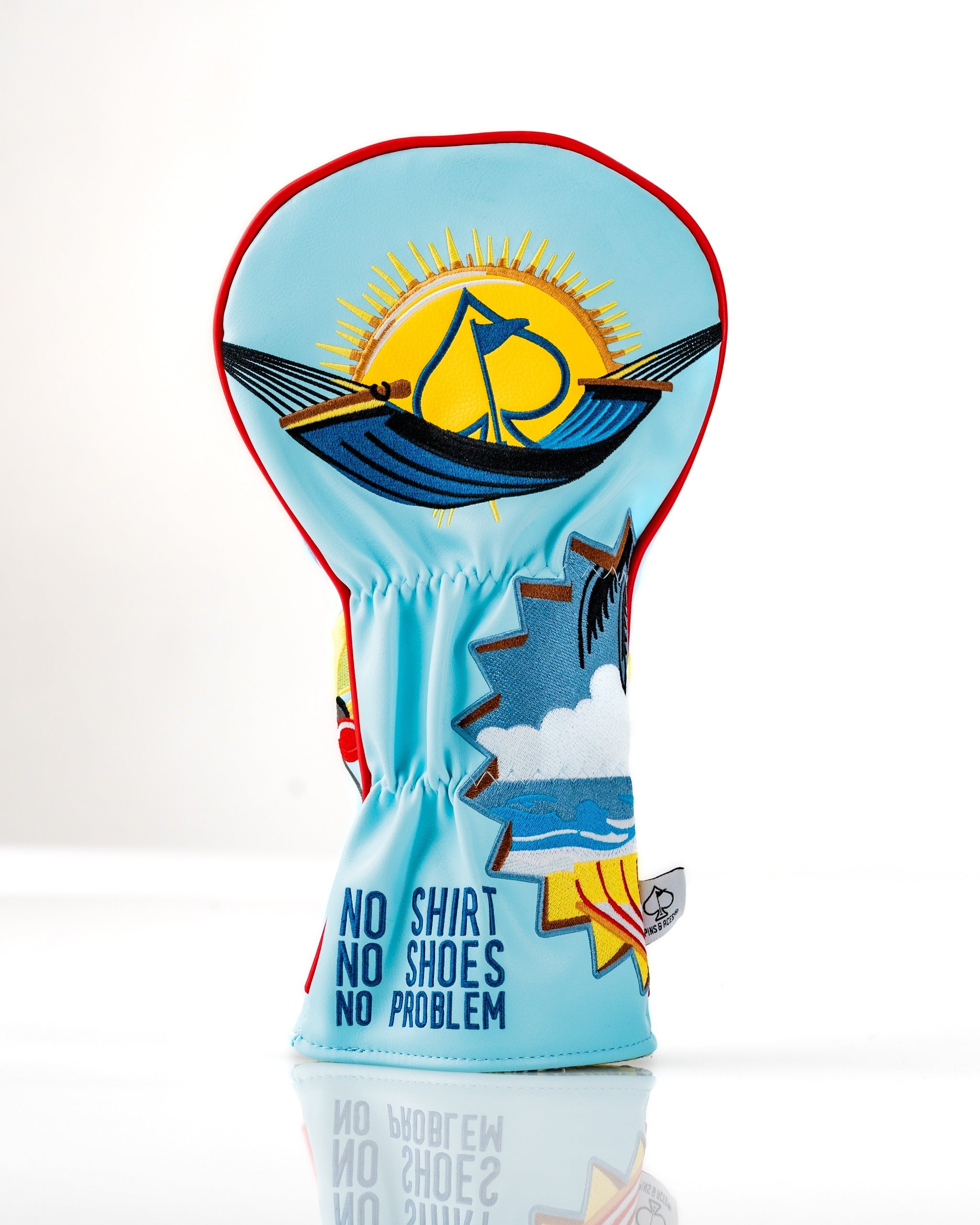 Brightly colored Margaritaville Fins Up driver cover featuring a beach scene with sun, ocean, and playful text.