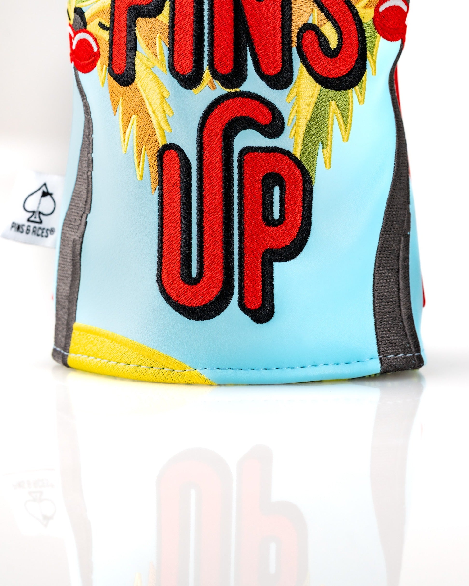 Colorful Margaritaville Fins Up driver cover featuring tropical designs and bold lettering for stylish golf protection.