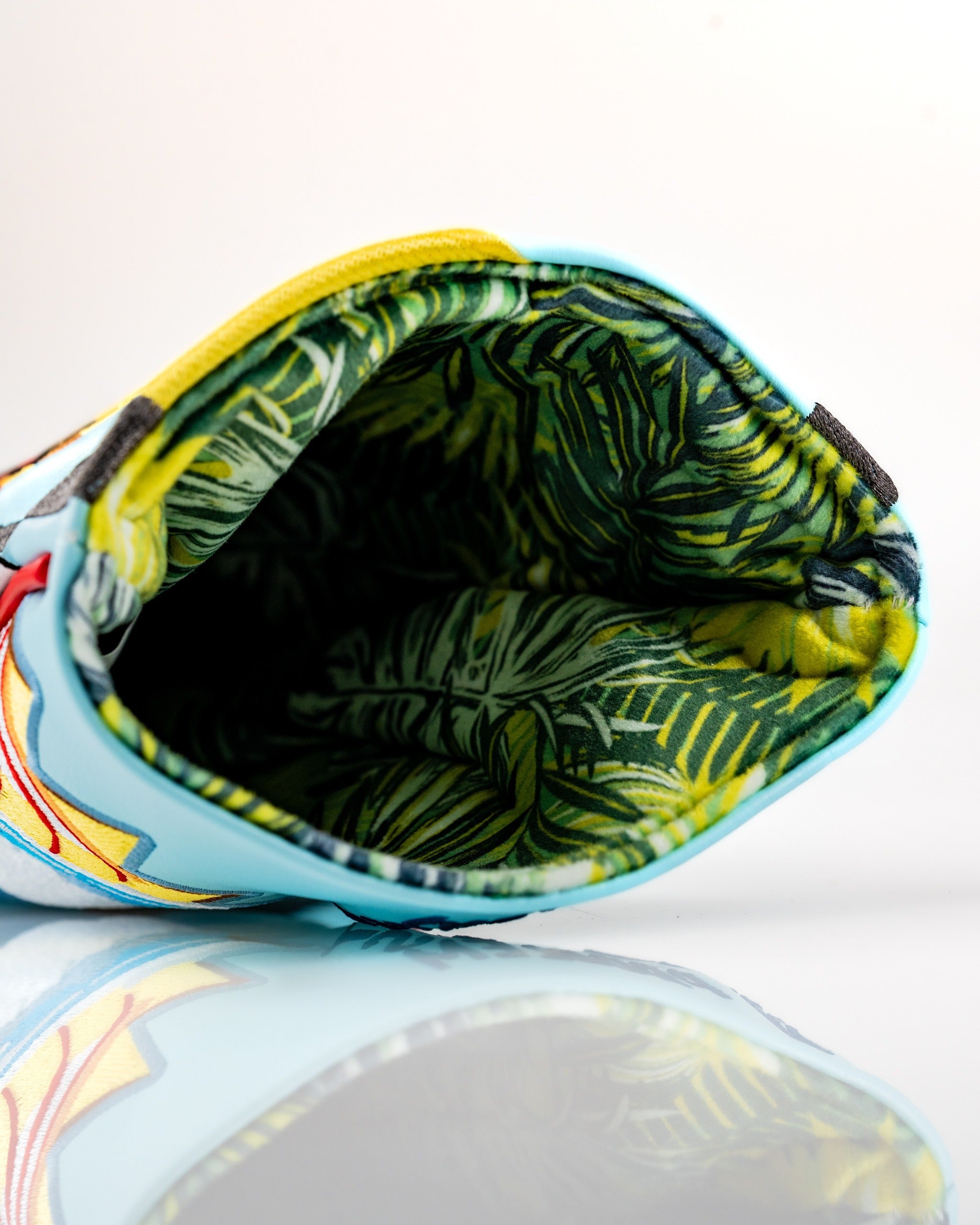 Brightly colored Margaritaville Fins Up driver cover featuring a tropical interior pattern, perfect for stylish golf protection.