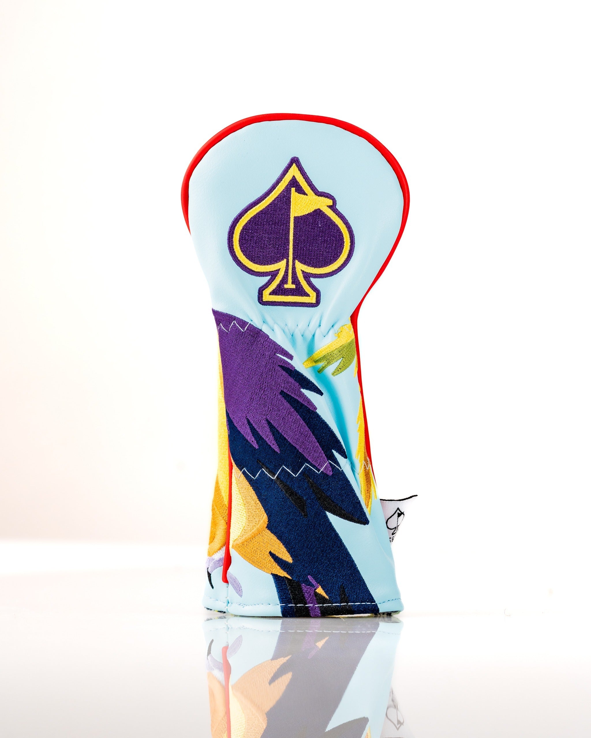 Colorful golf headcover featuring a vibrant tropical design with an ace of spades emblem, perfect for stylish golfers.