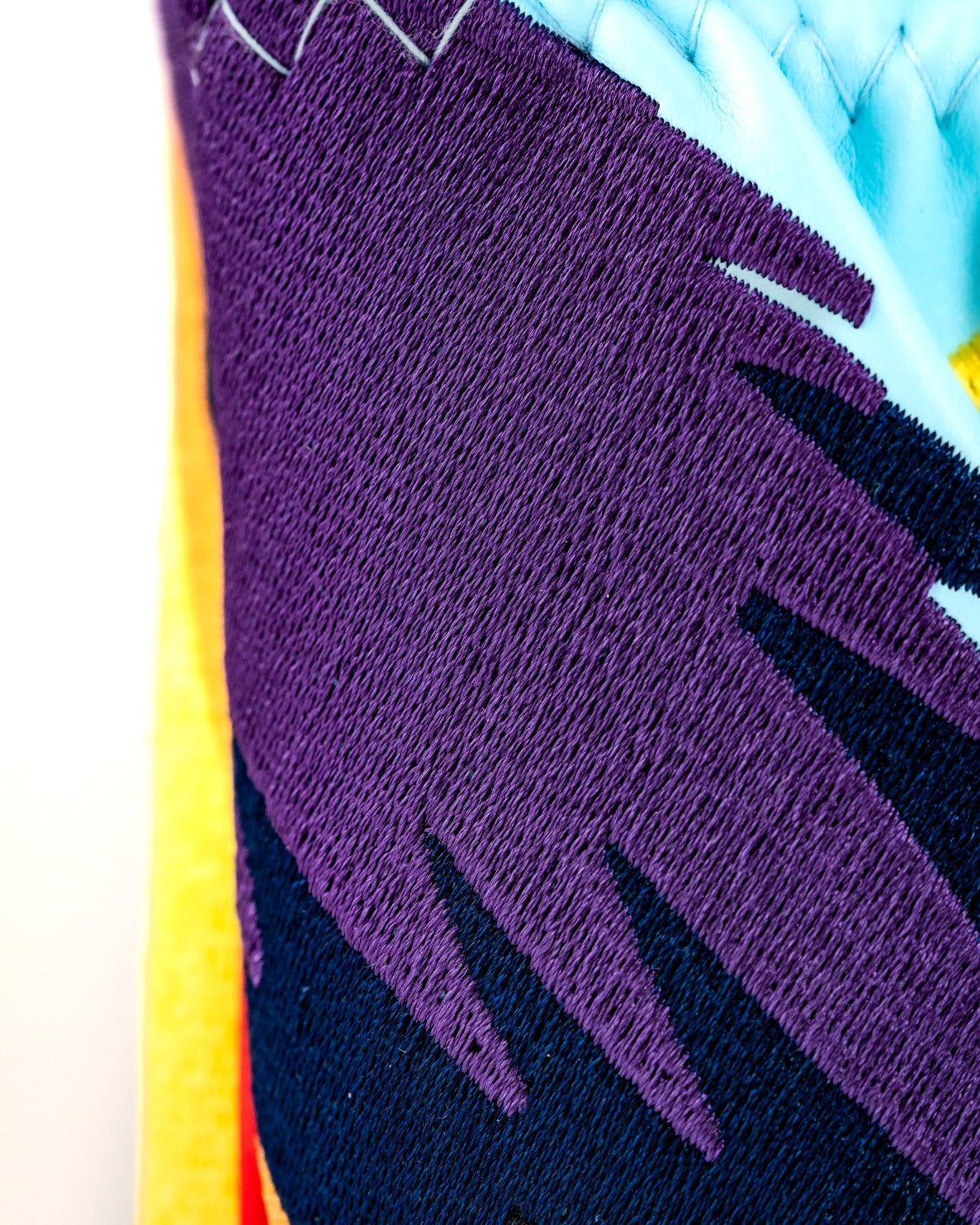 Close-up of the Margaritaville Polly Hybrid, showcasing vibrant colors and intricate stitching details on a golf headcover.