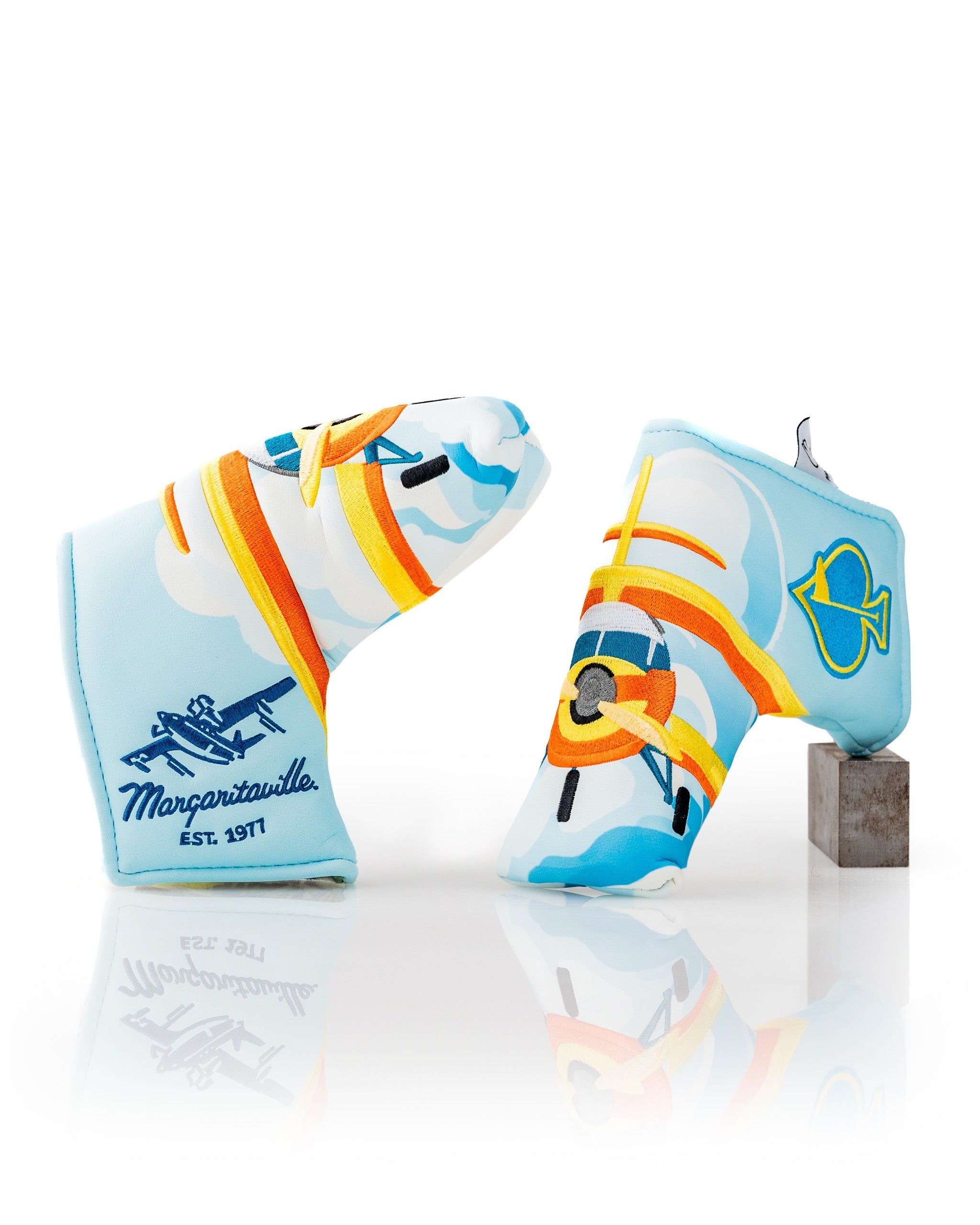 Colorful Margaritaville Puddle Jumper blade putter cover featuring a fun airplane and fish design, perfect for golfers.