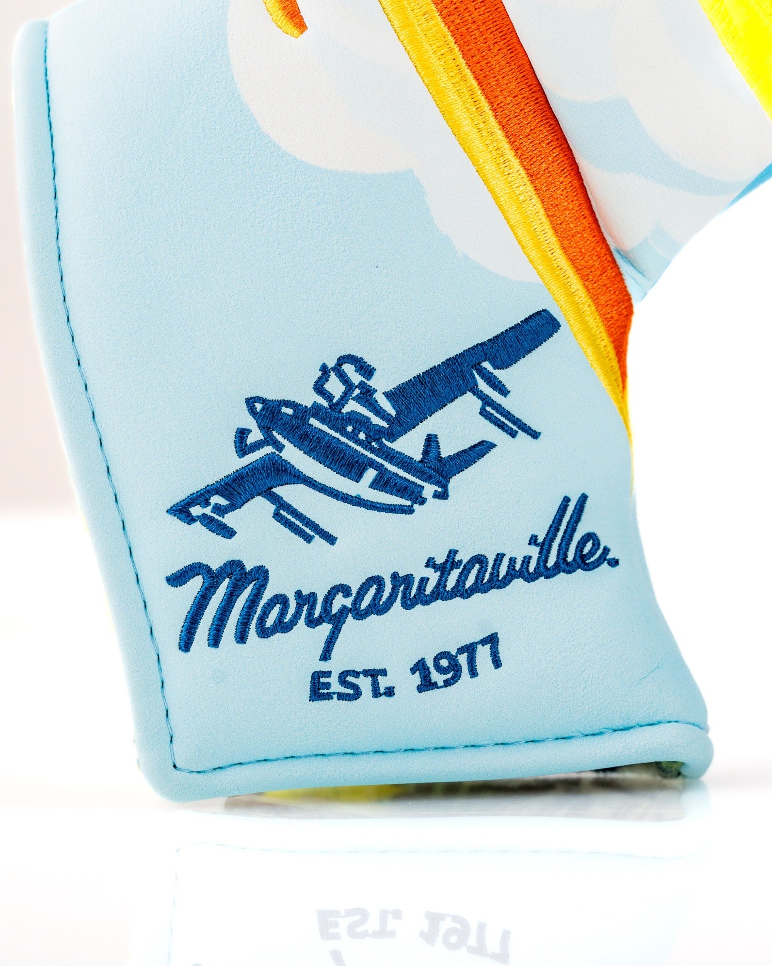 Margaritaville Puddle Jumper blade putter cover featuring a colorful design and logo, perfect for stylish golfers.