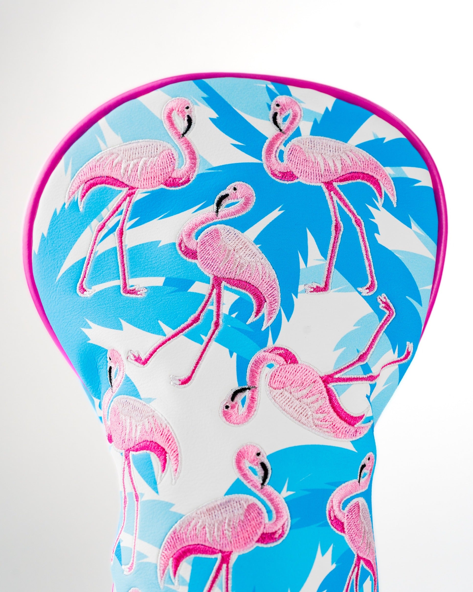Colorful fairway cover featuring a vibrant flamingo design on a blue and white background, perfect for stylish golfers.
