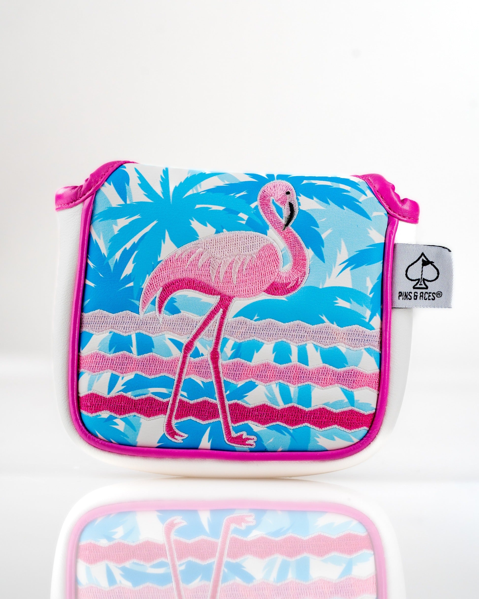 Vibrant mallet putter cover featuring a pink flamingo design against a tropical blue background, perfect for stylish golfers.
