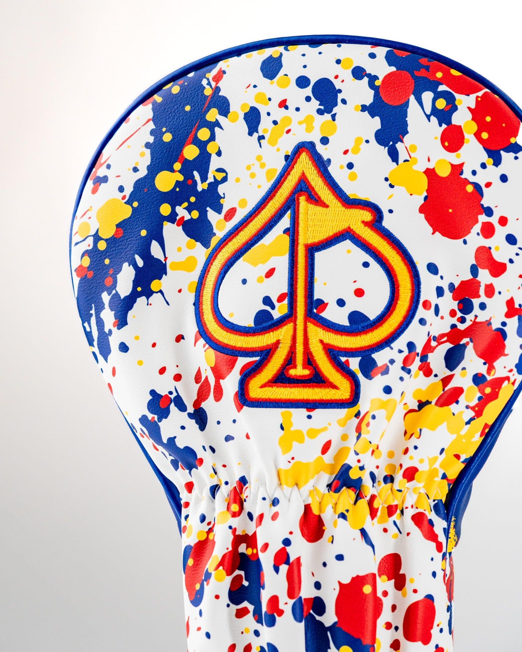 Bold Colorado 2.0 driver cover featuring a vibrant splatter design and an iconic spade logo, perfect for standout golfers.