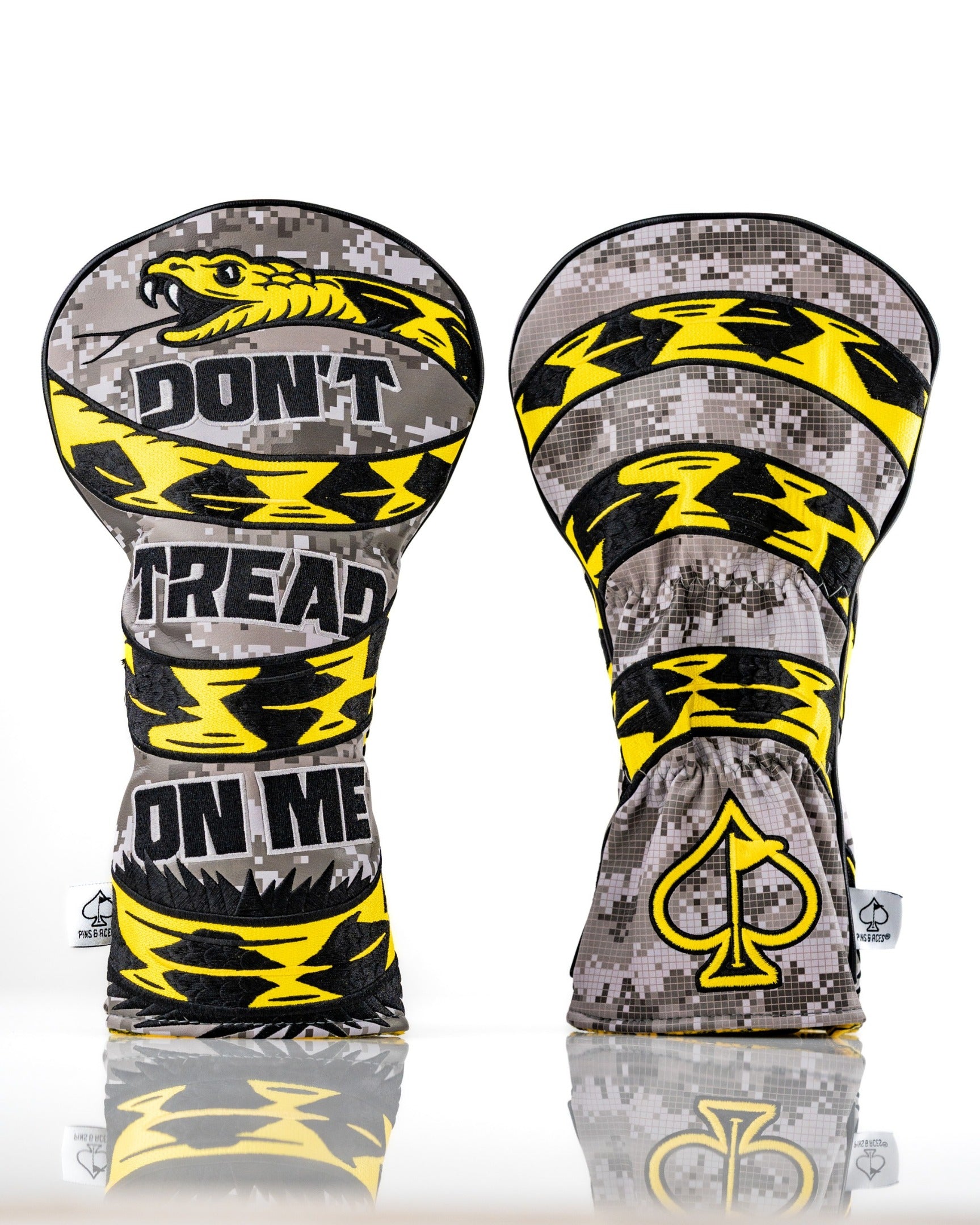 Bold golf driver cover featuring a "Don't Tread On Me" design with a snake and striking yellow accents on a camo background.